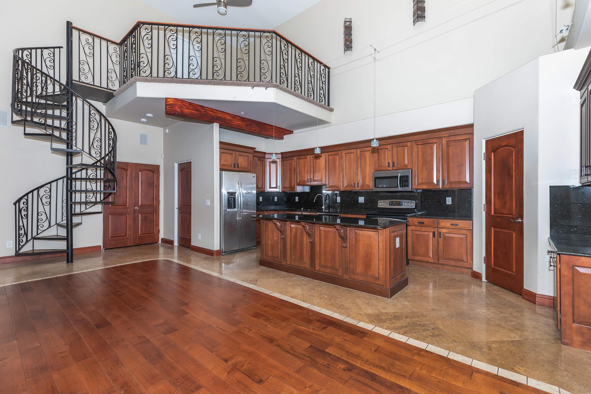 a kitchen with a wood floor