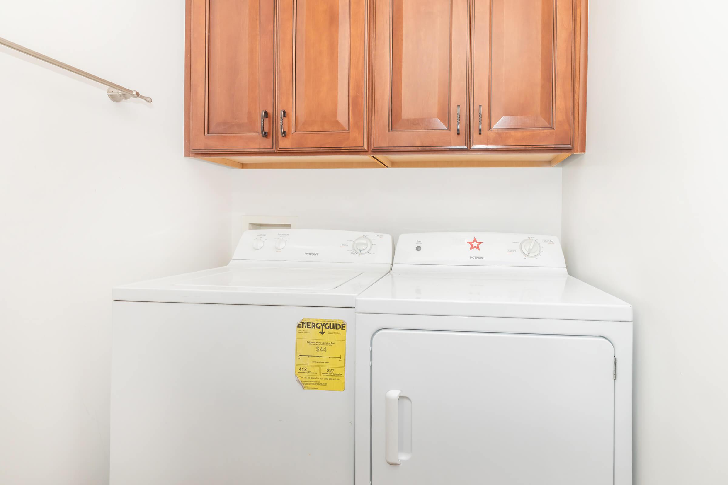 a white refrigerator freezer sitting inside of a kitchen