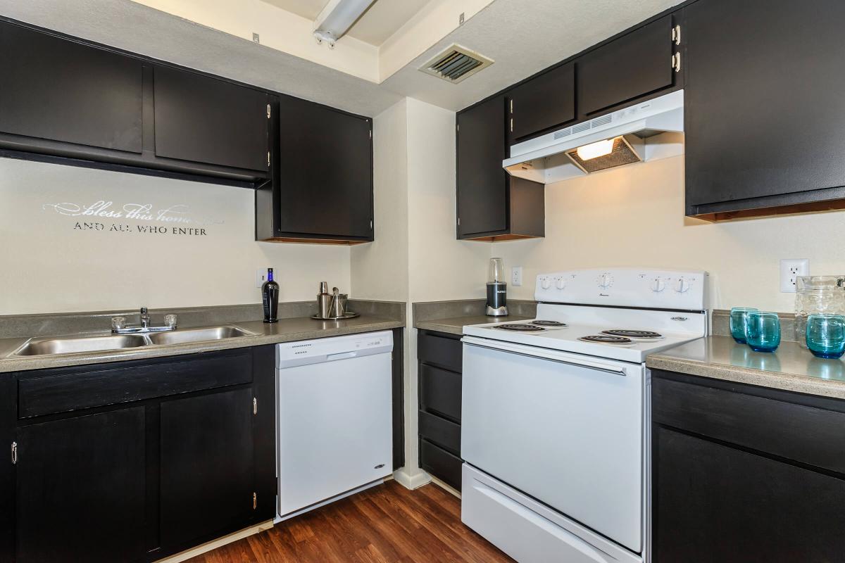 a kitchen with a sink and a refrigerator