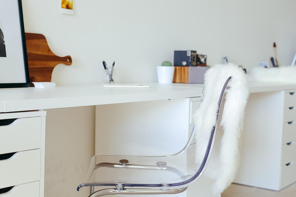 a white tub sitting next to a sink