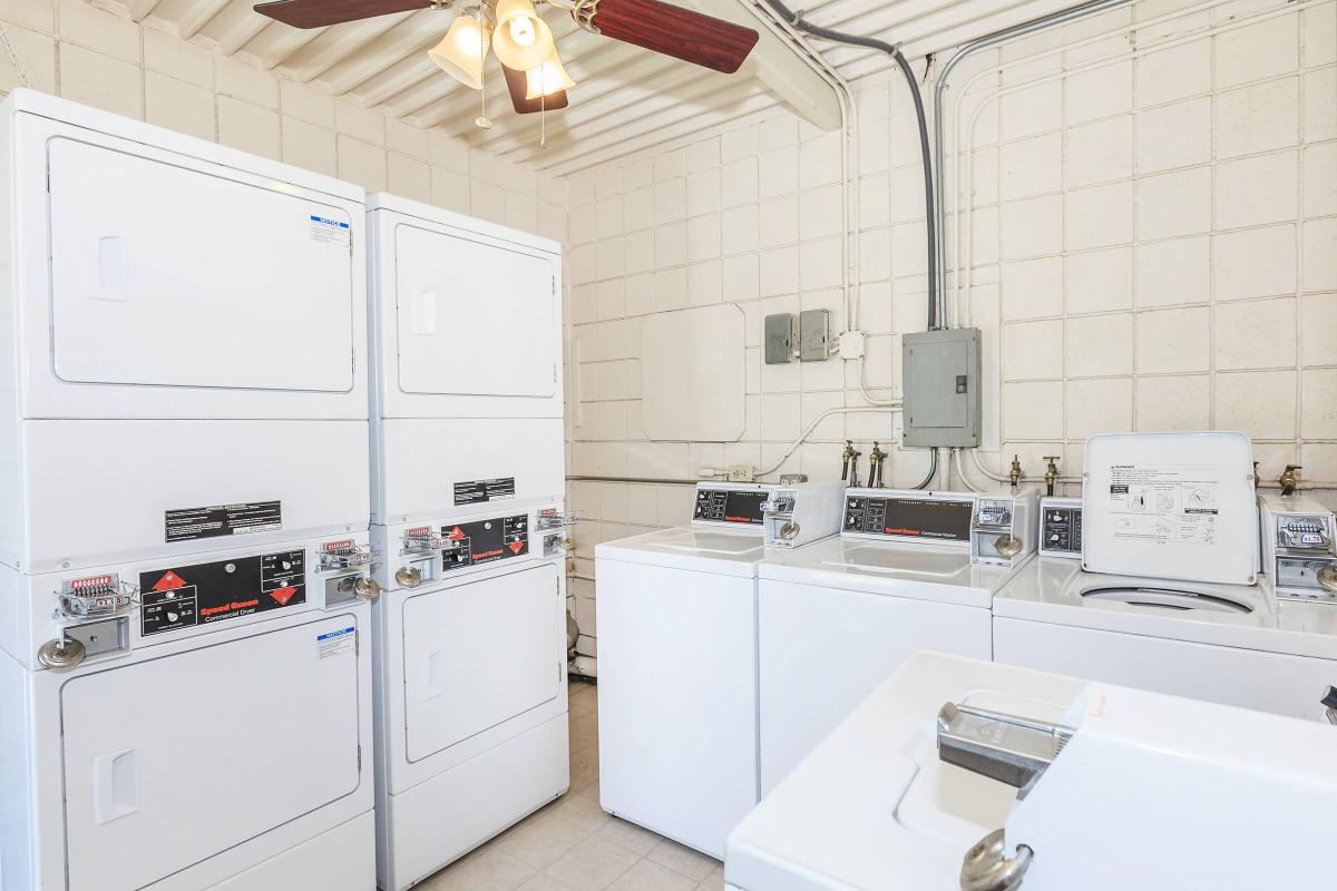 a white refrigerator freezer sitting inside of a kitchen