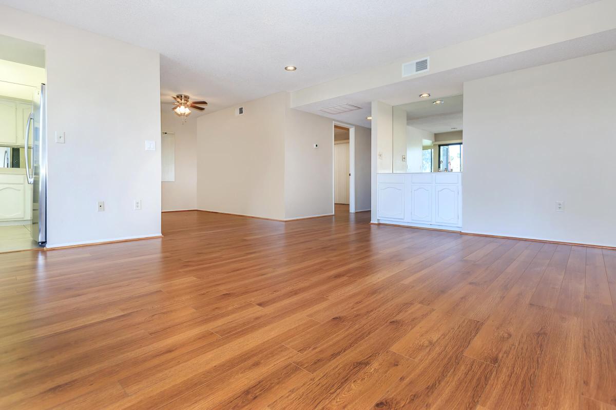 a large empty room with a wood floor