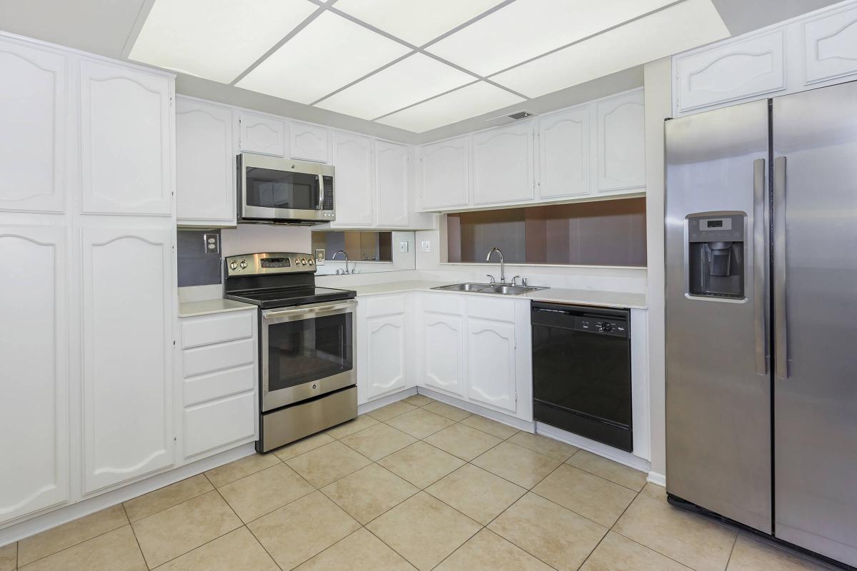 a stainless steel refrigerator in a kitchen