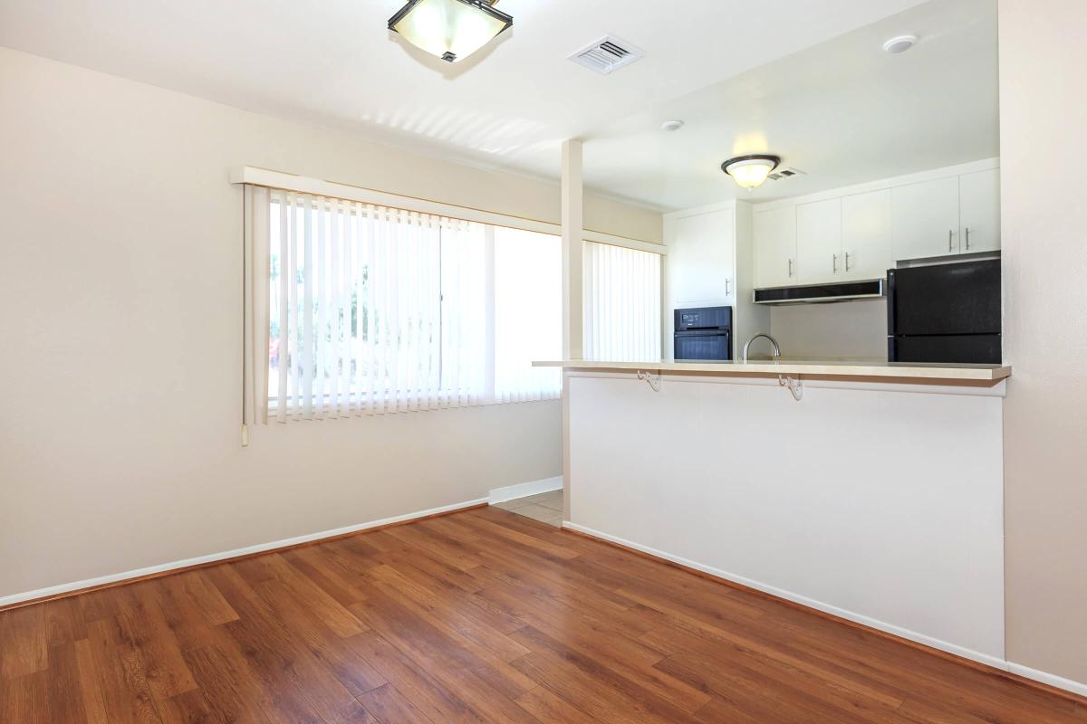 a large empty room with a wood floor