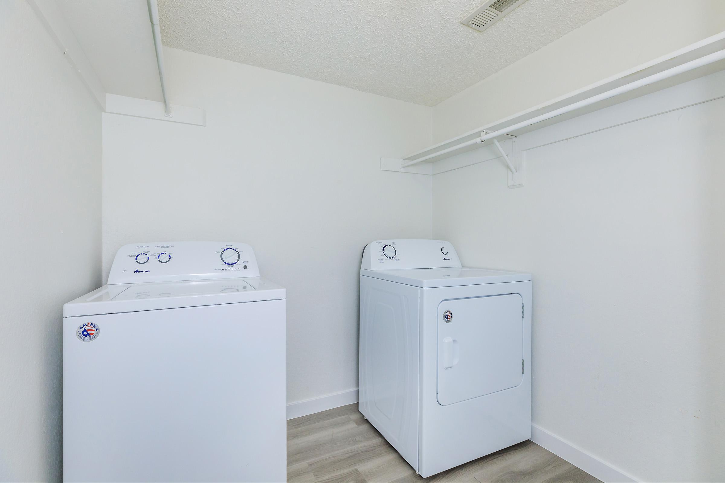 a refrigerator freezer sitting in a room