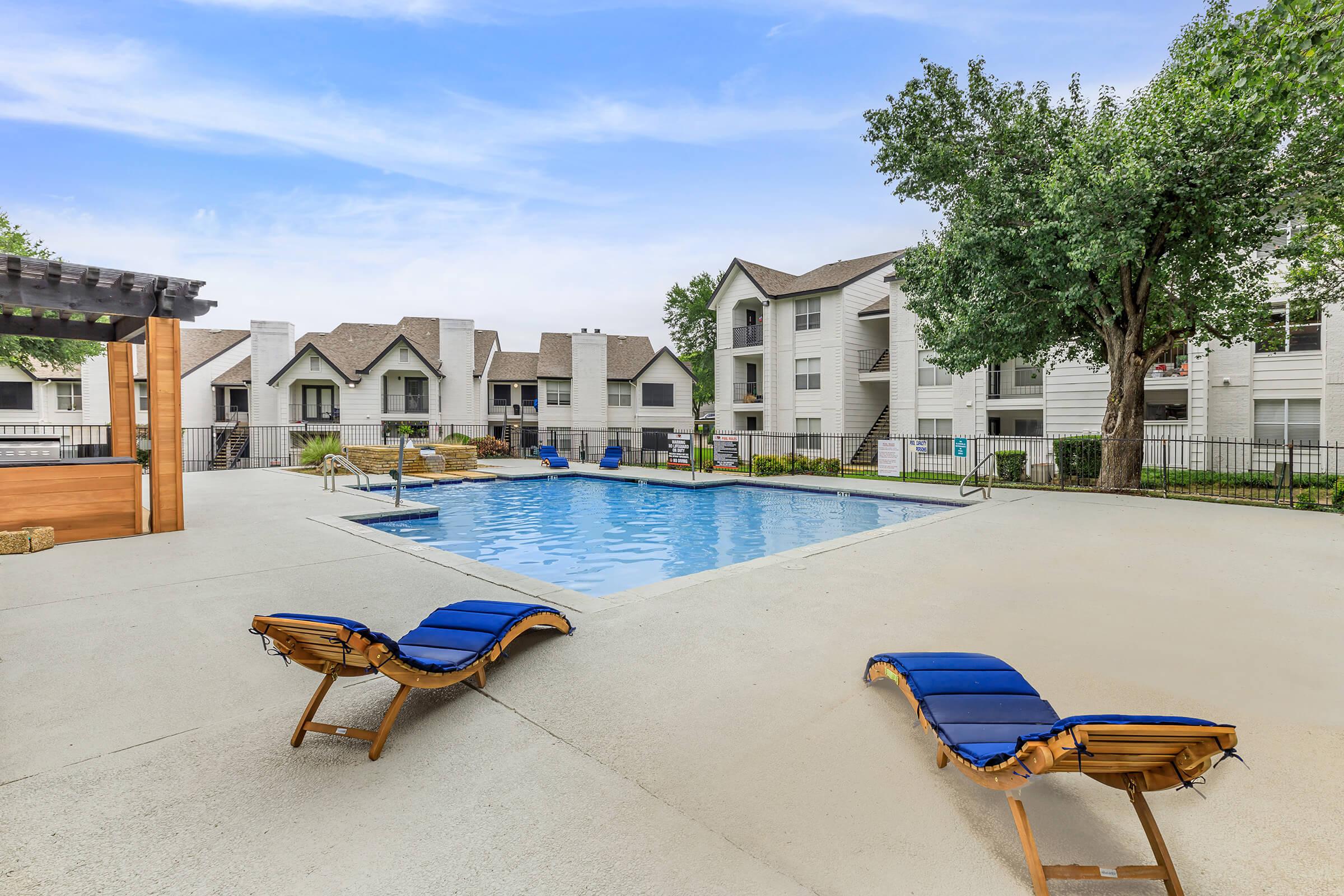 a chair sitting in front of a pool