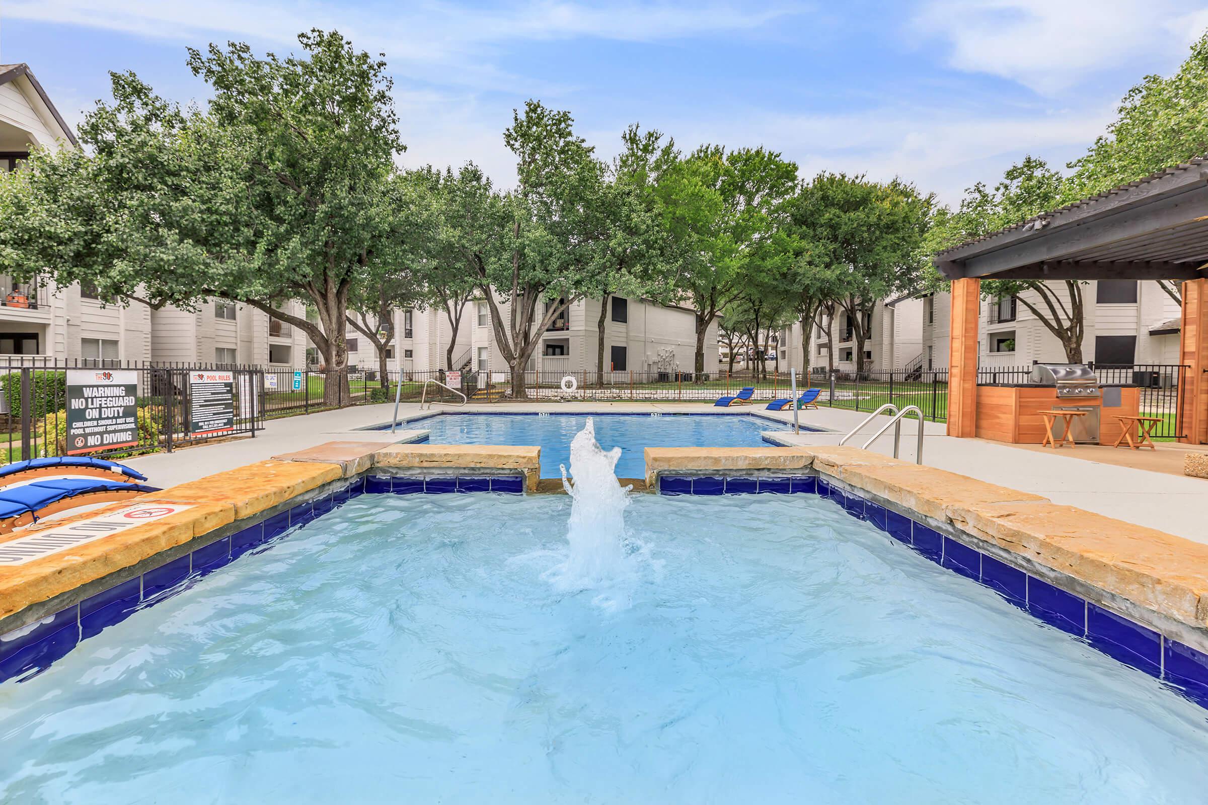 a house with a large pool of water