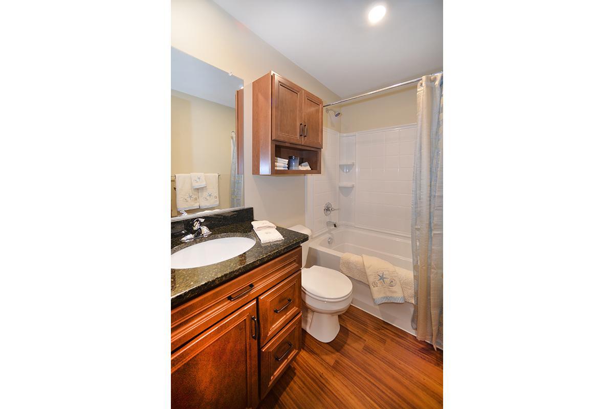 a kitchen with a sink and a mirror