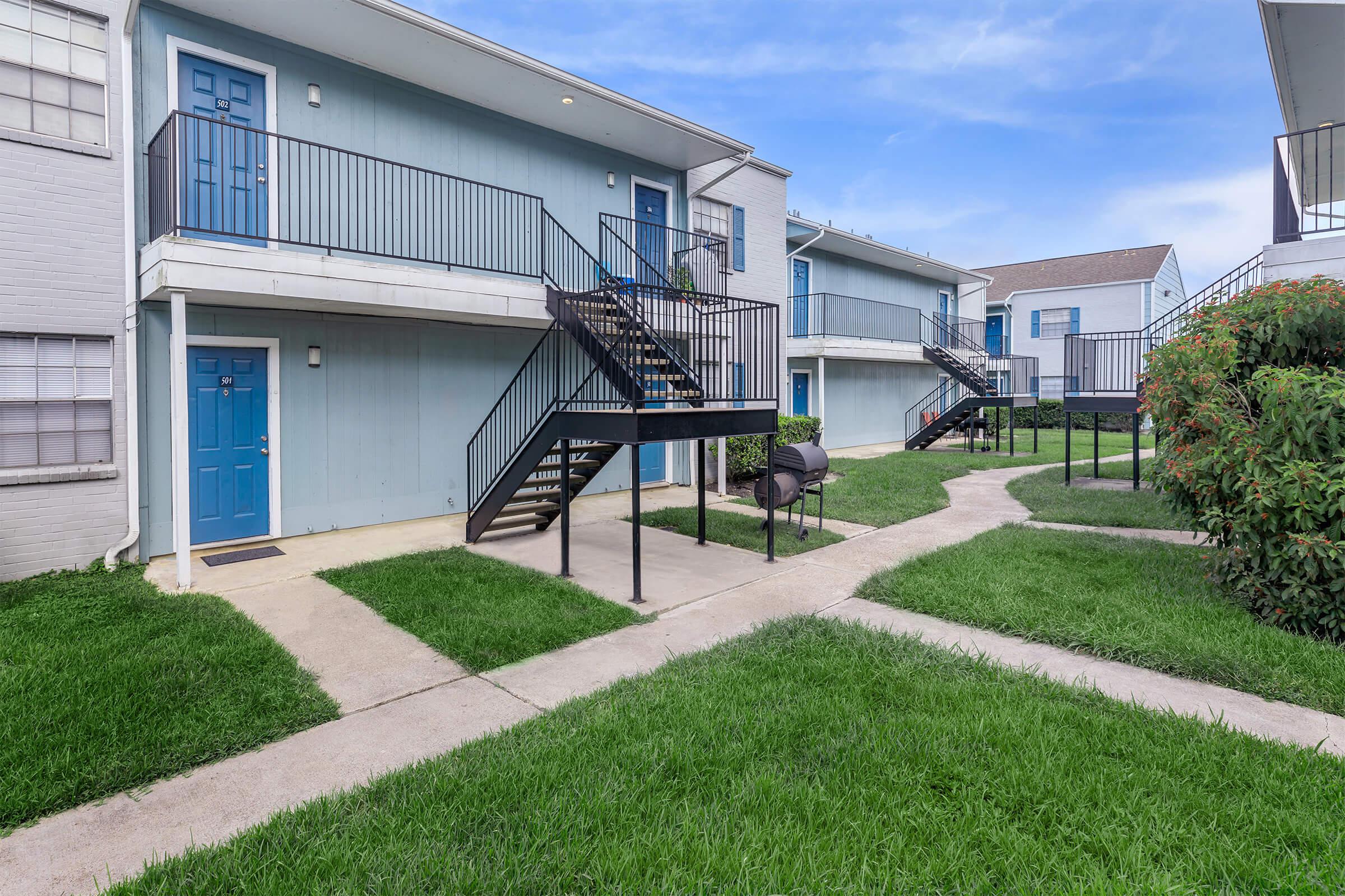 a large lawn in front of a building