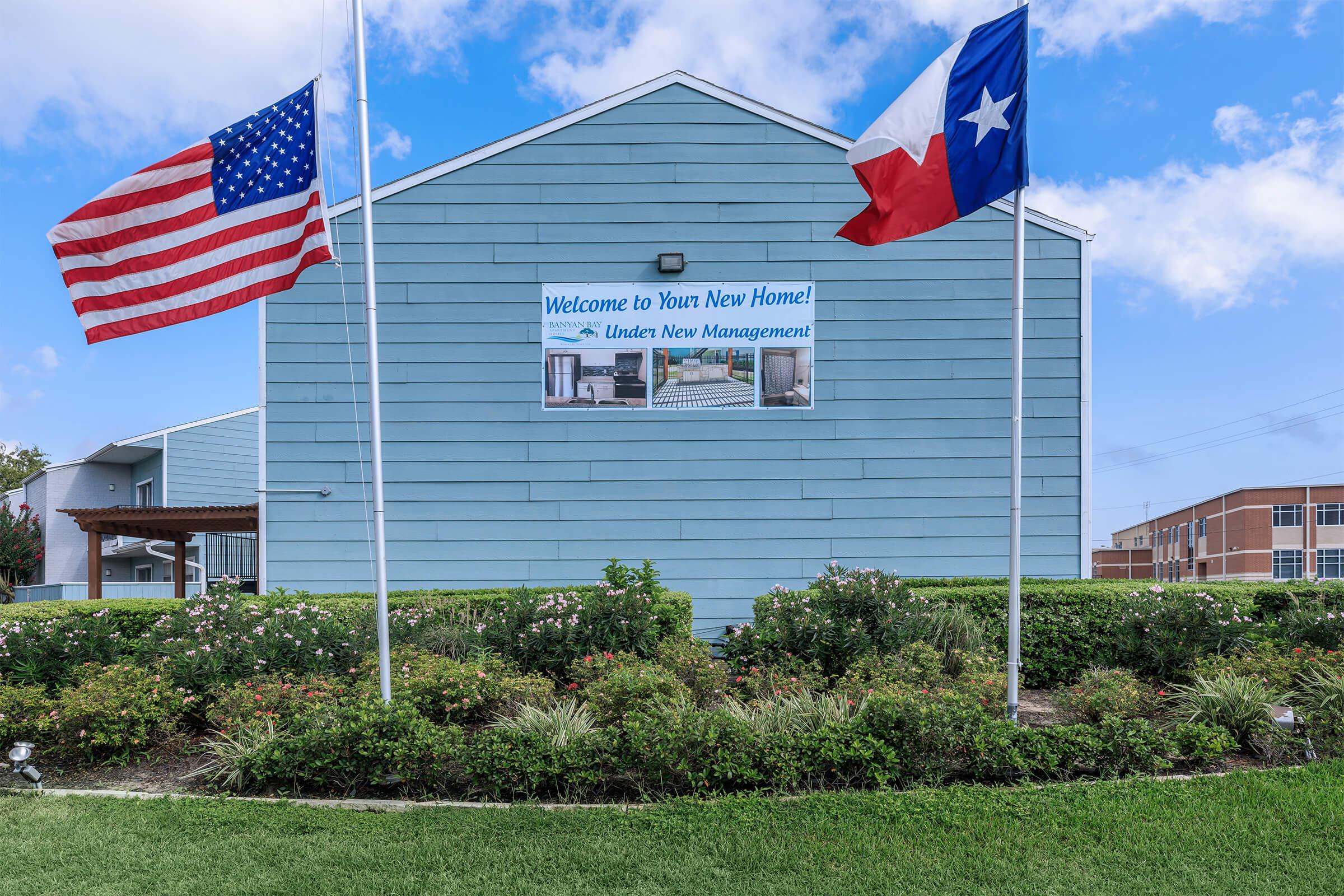 a flag flying in front of a building