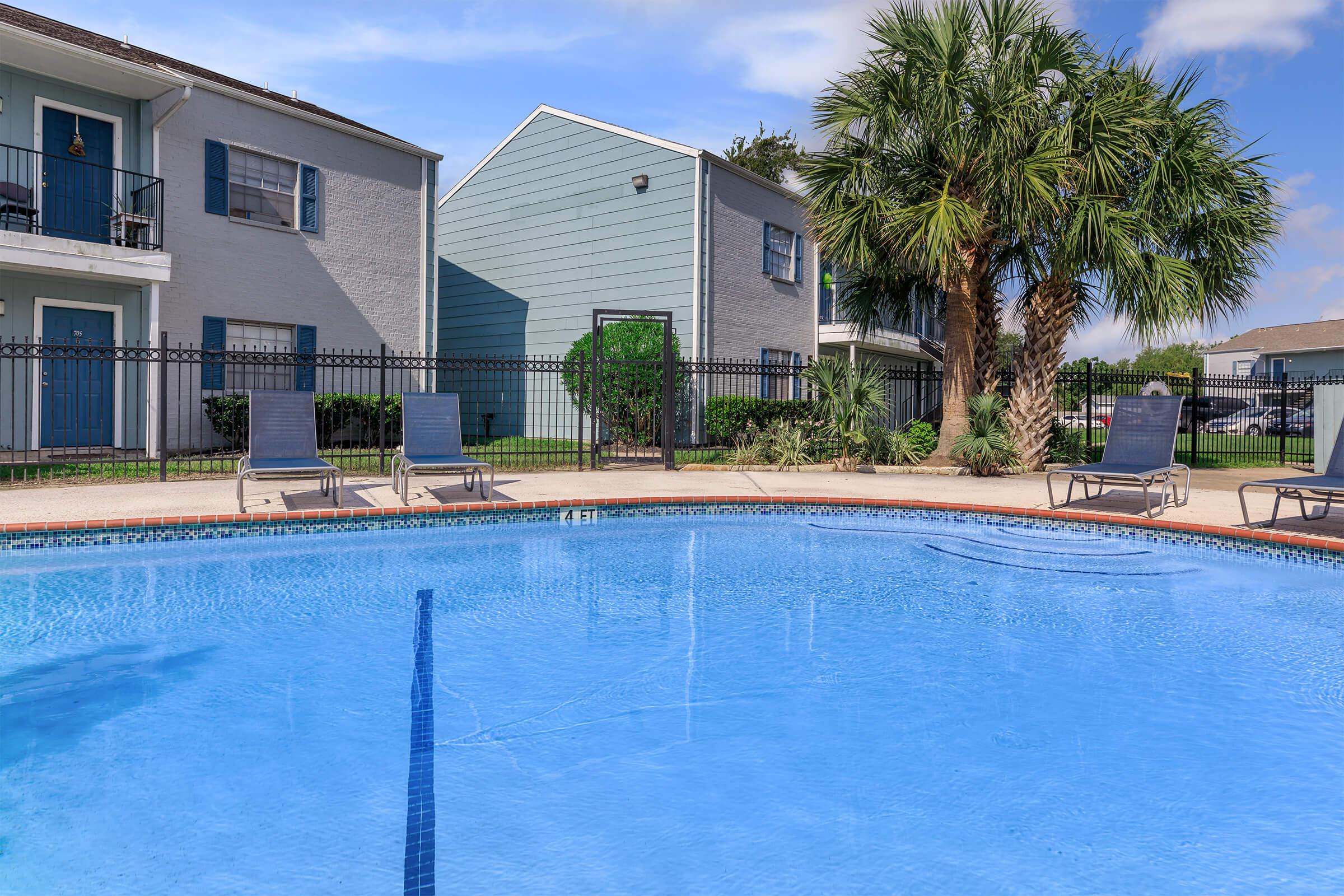 a large pool of water in front of a house