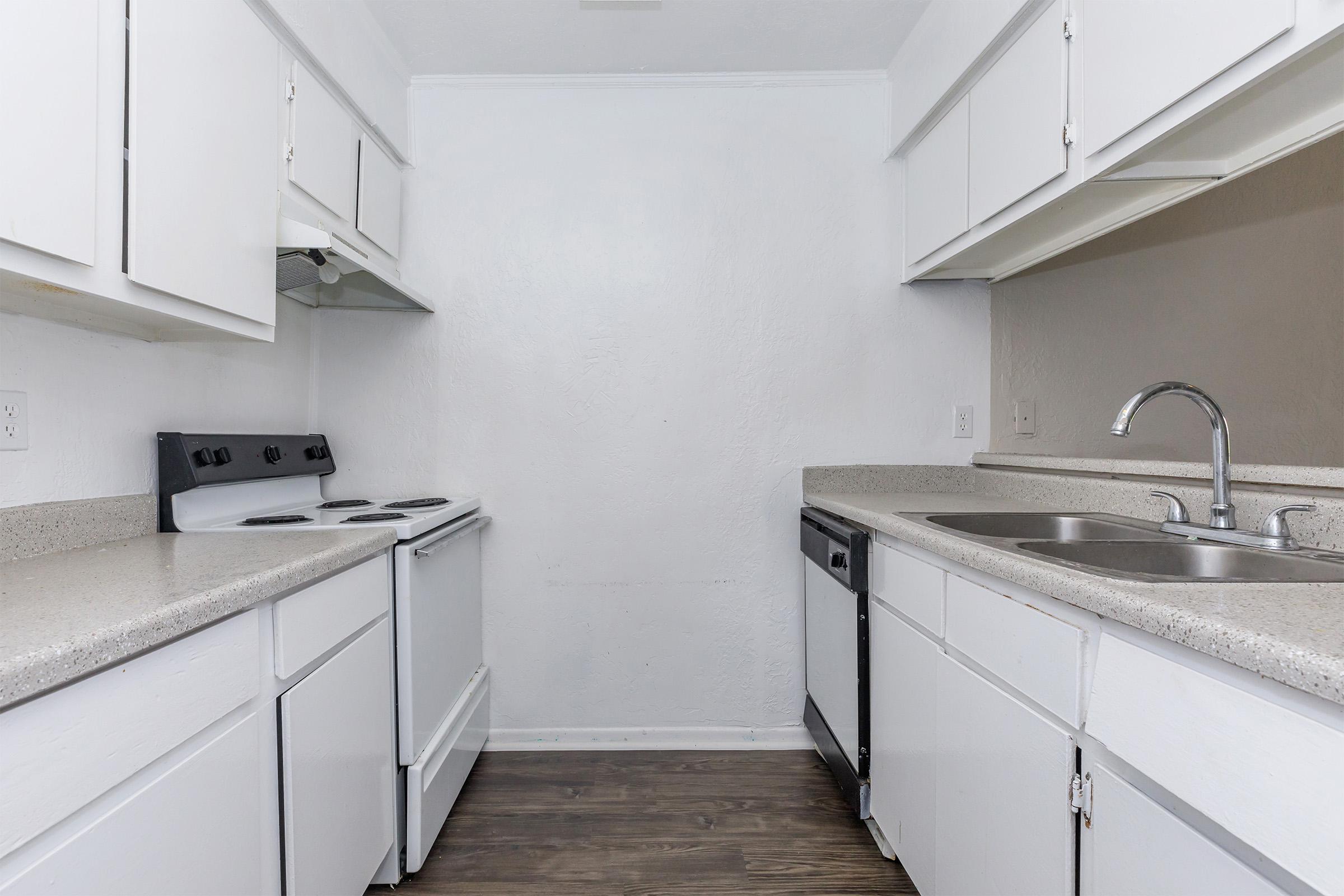 a kitchen with a stove and a sink