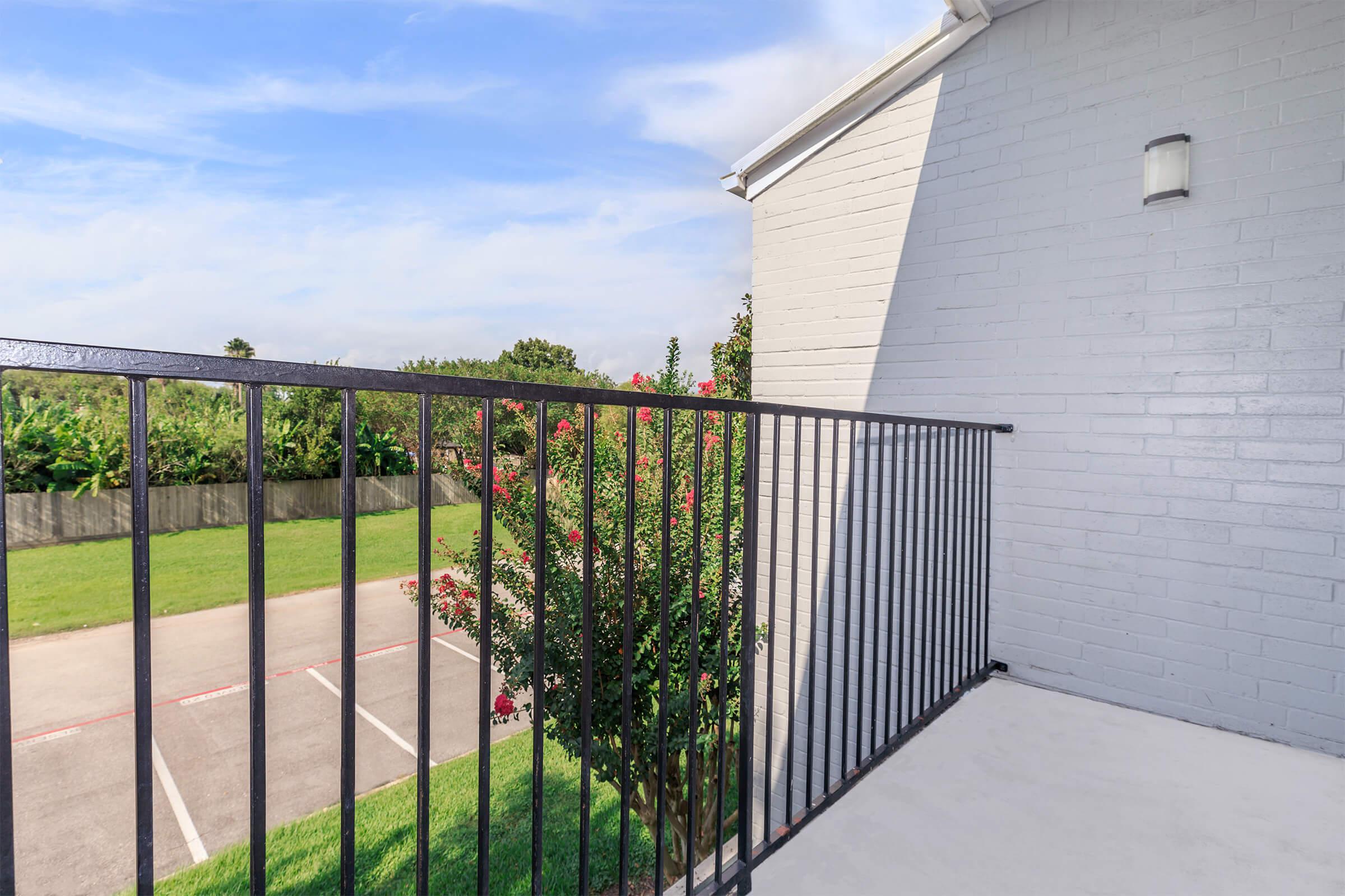 a gate in front of a fence