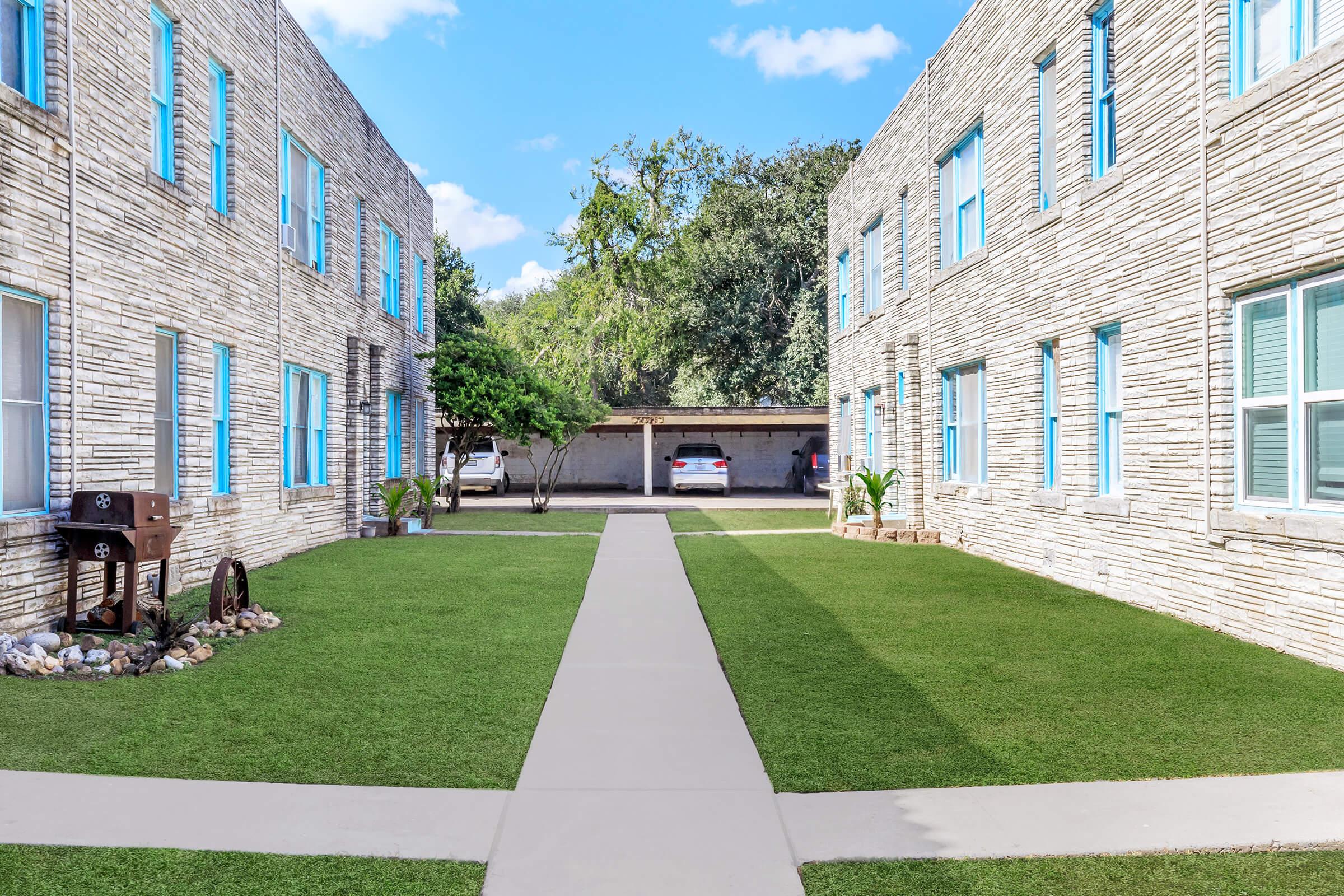 a large lawn in front of a building