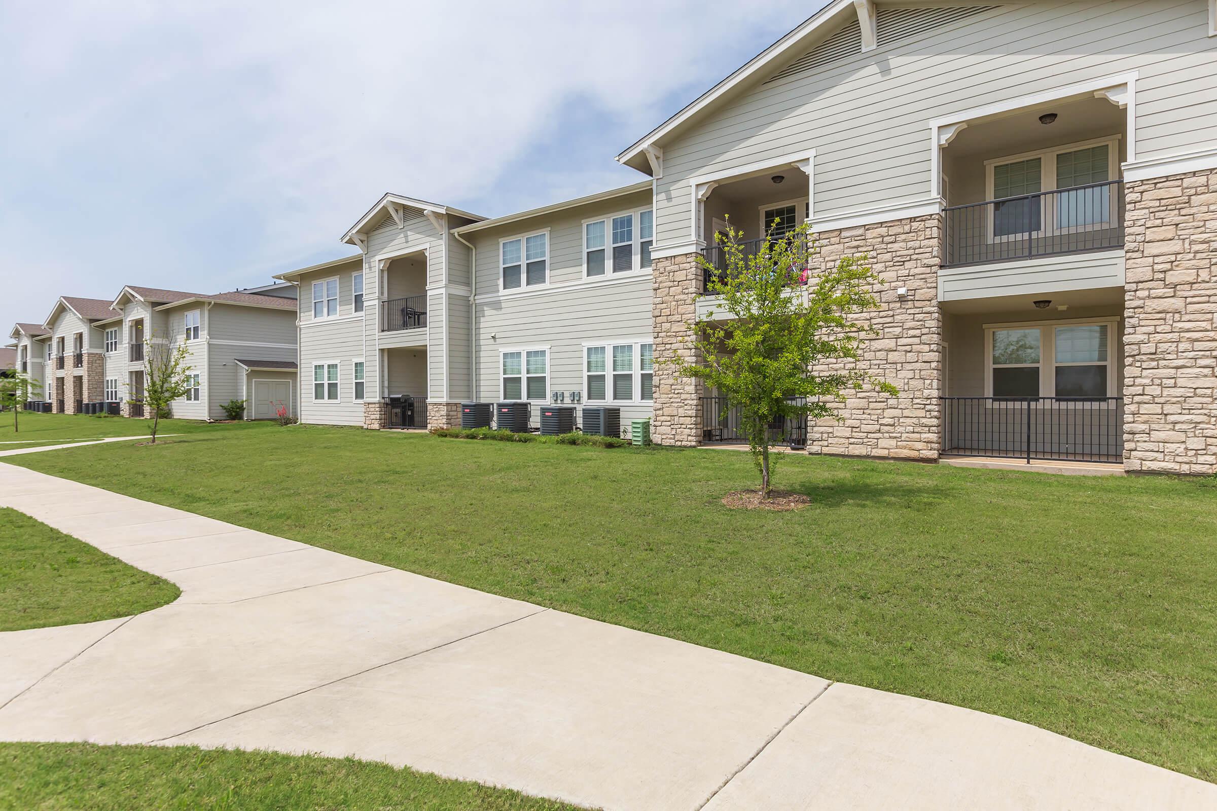 a large lawn in front of a house