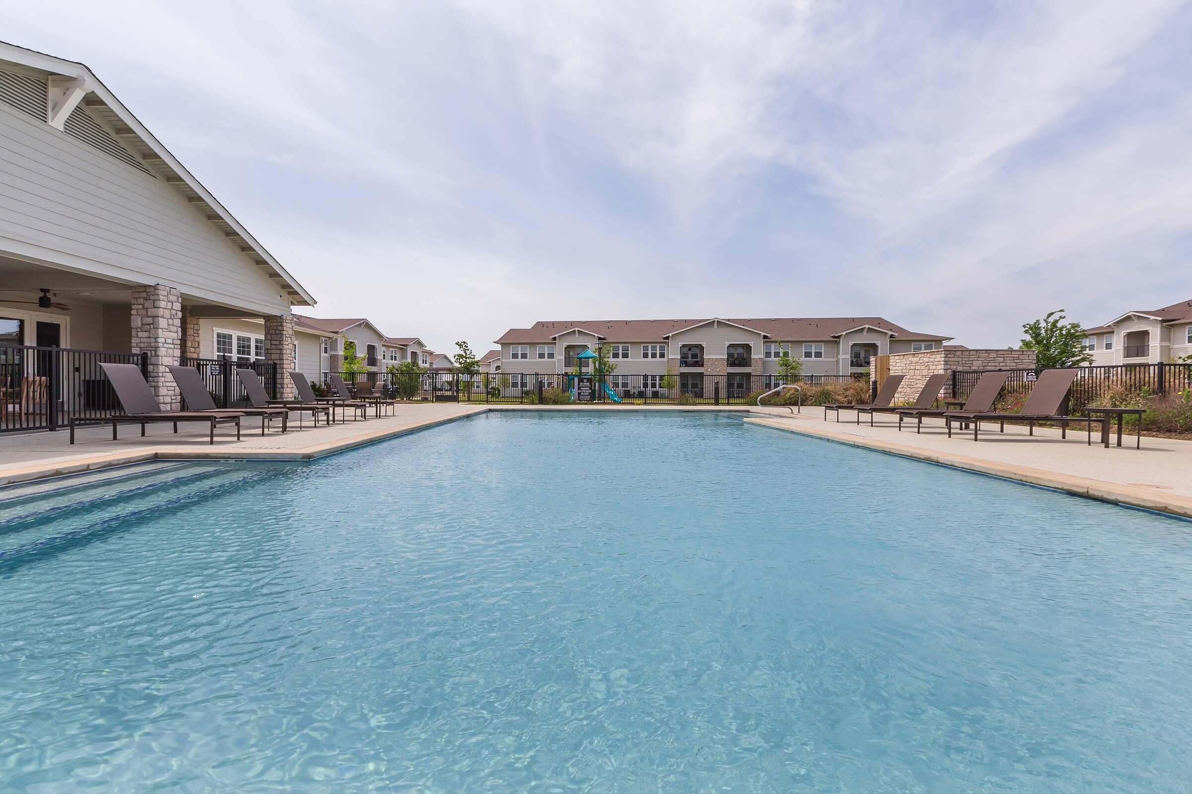 a pool next to a body of water