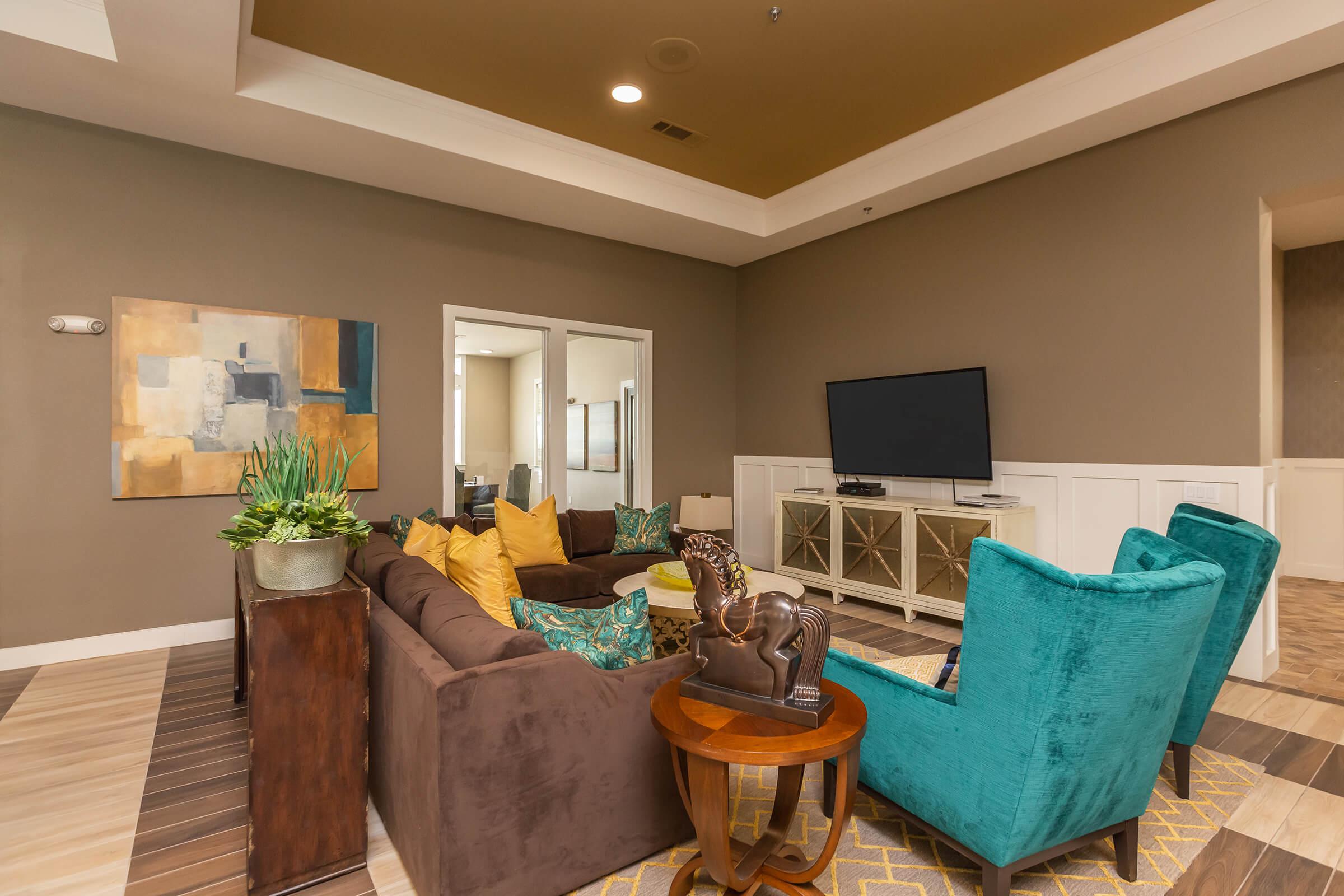 a living room filled with furniture and a table