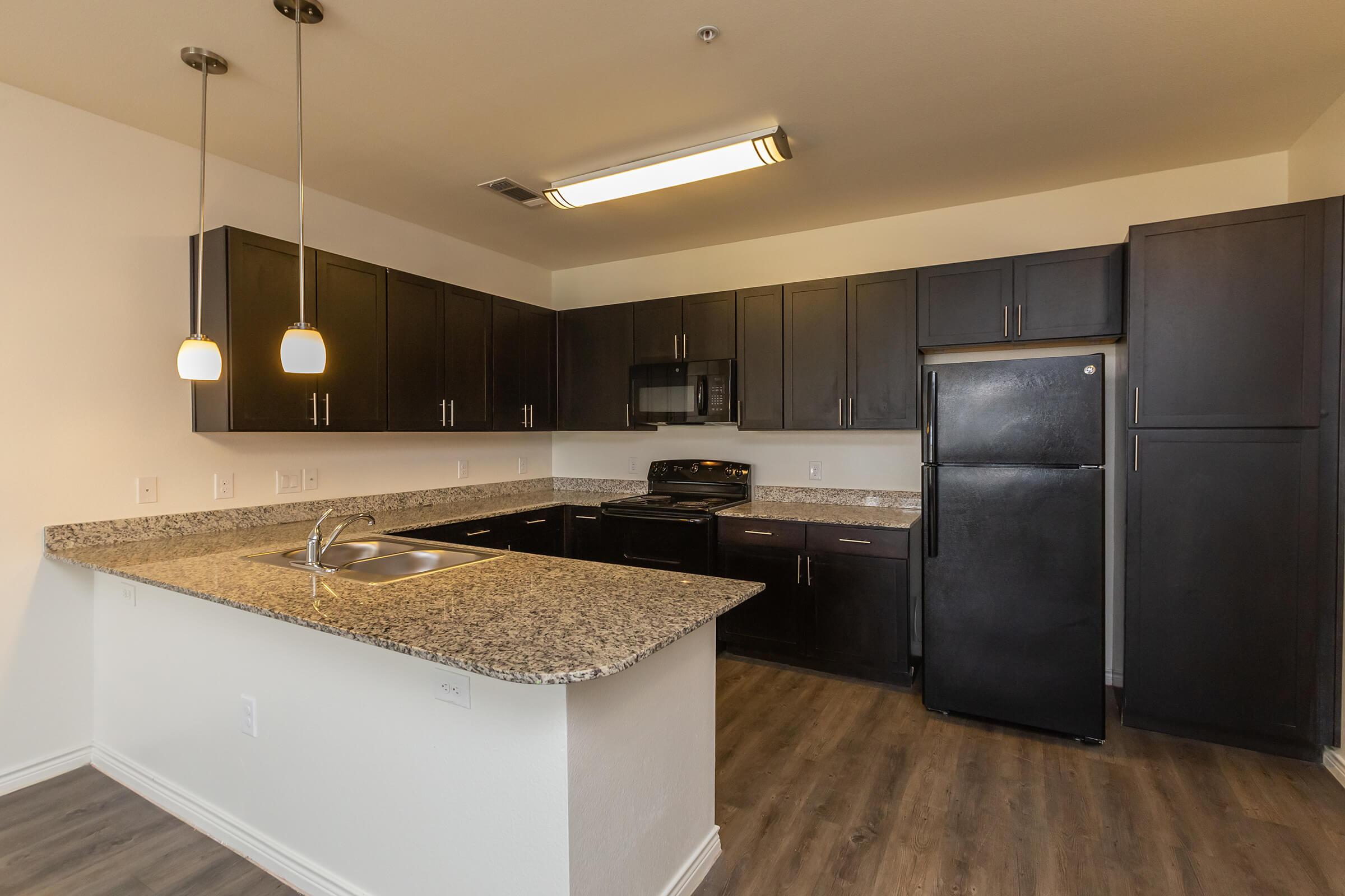 a large kitchen with stainless steel appliances