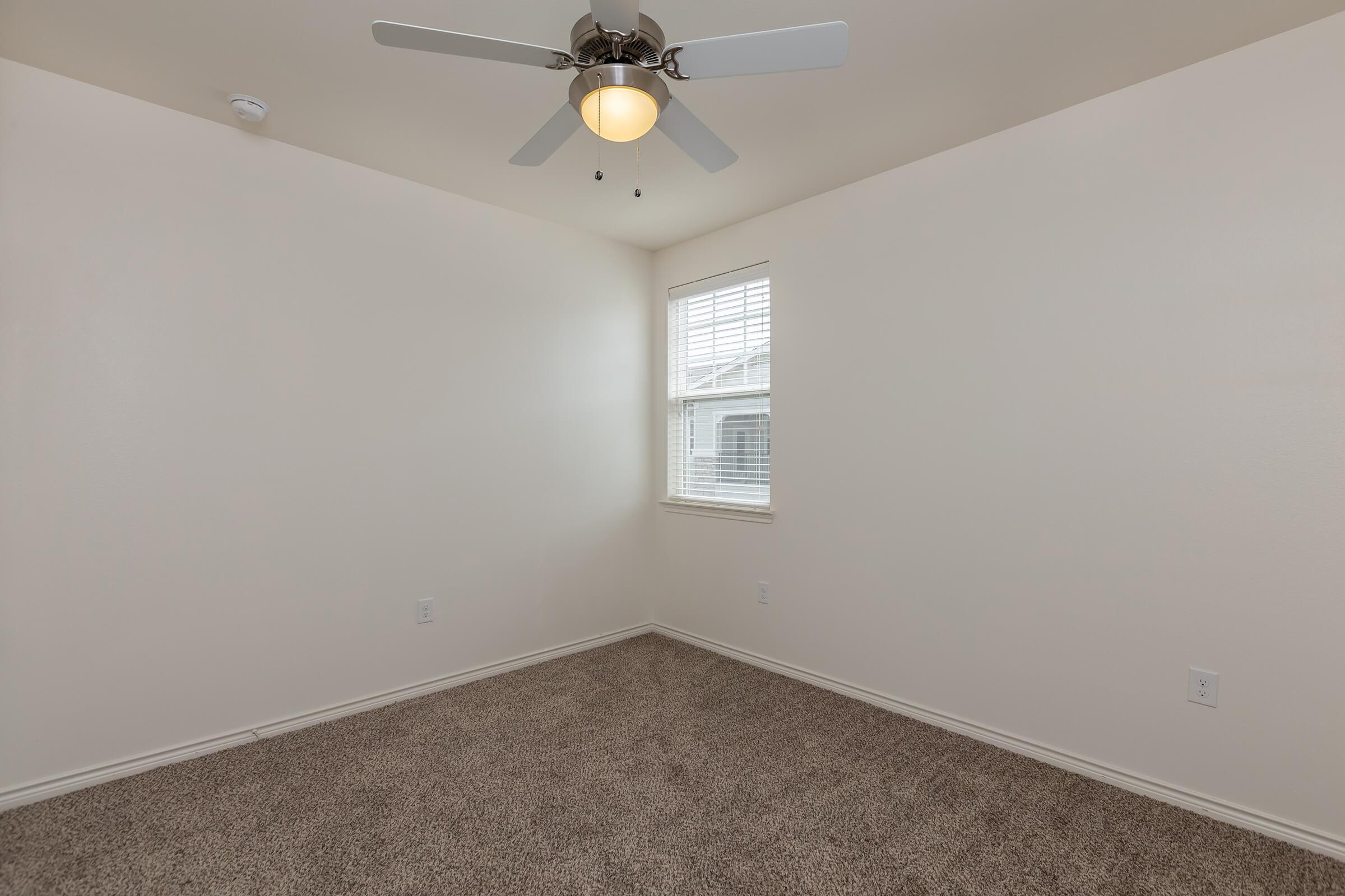 a bedroom with a large mirror