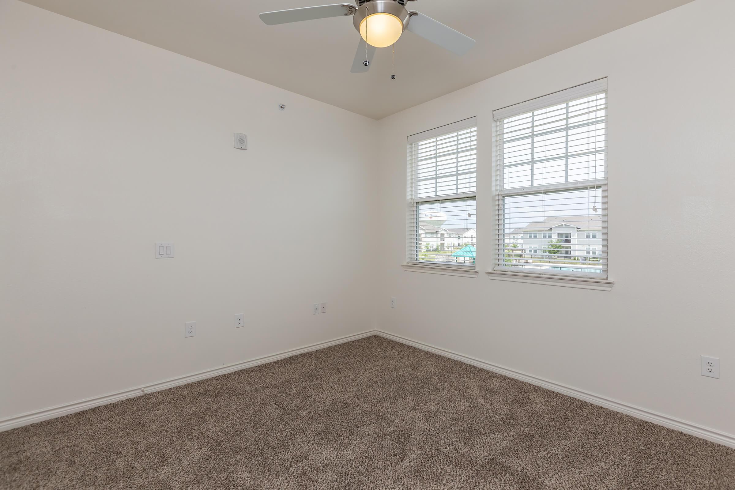 a bedroom with a large window