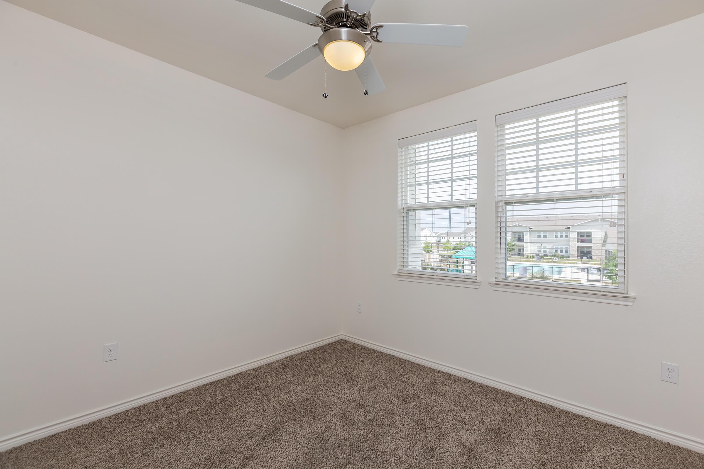 a bedroom with a large window