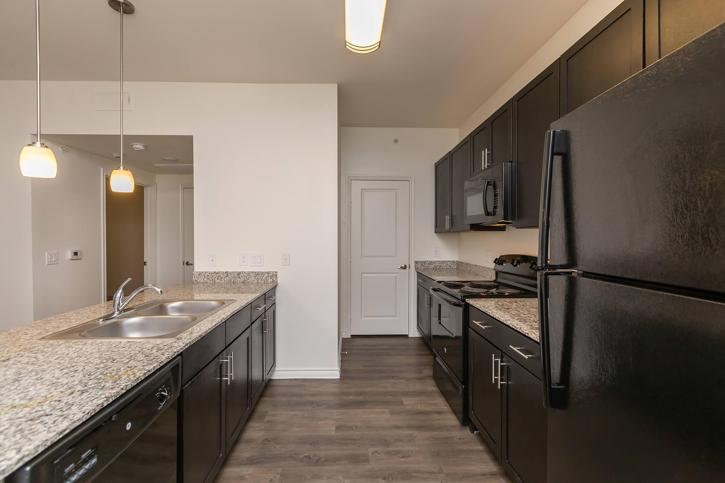 a large kitchen with stainless steel appliances