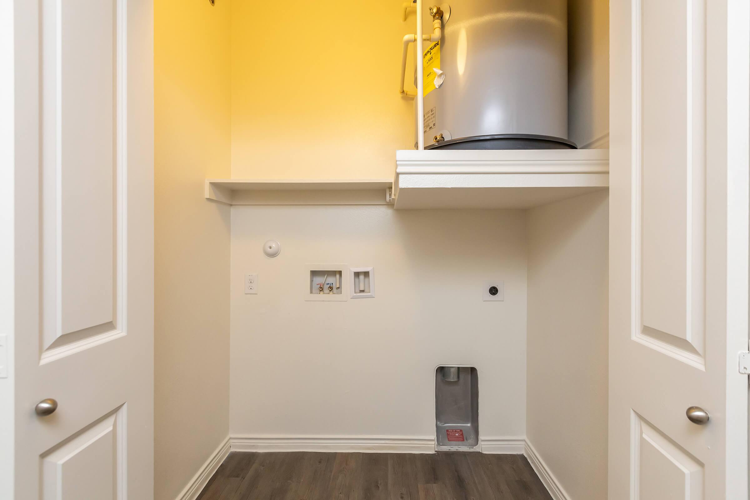 a kitchen with a sink and a mirror