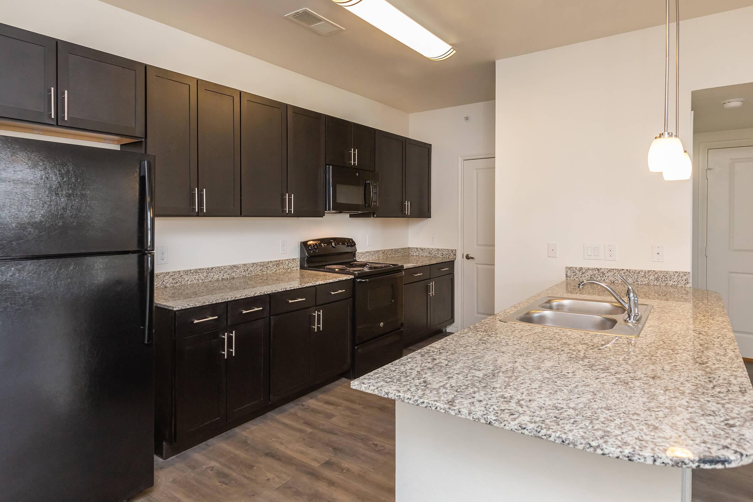 a modern kitchen with stainless steel appliances