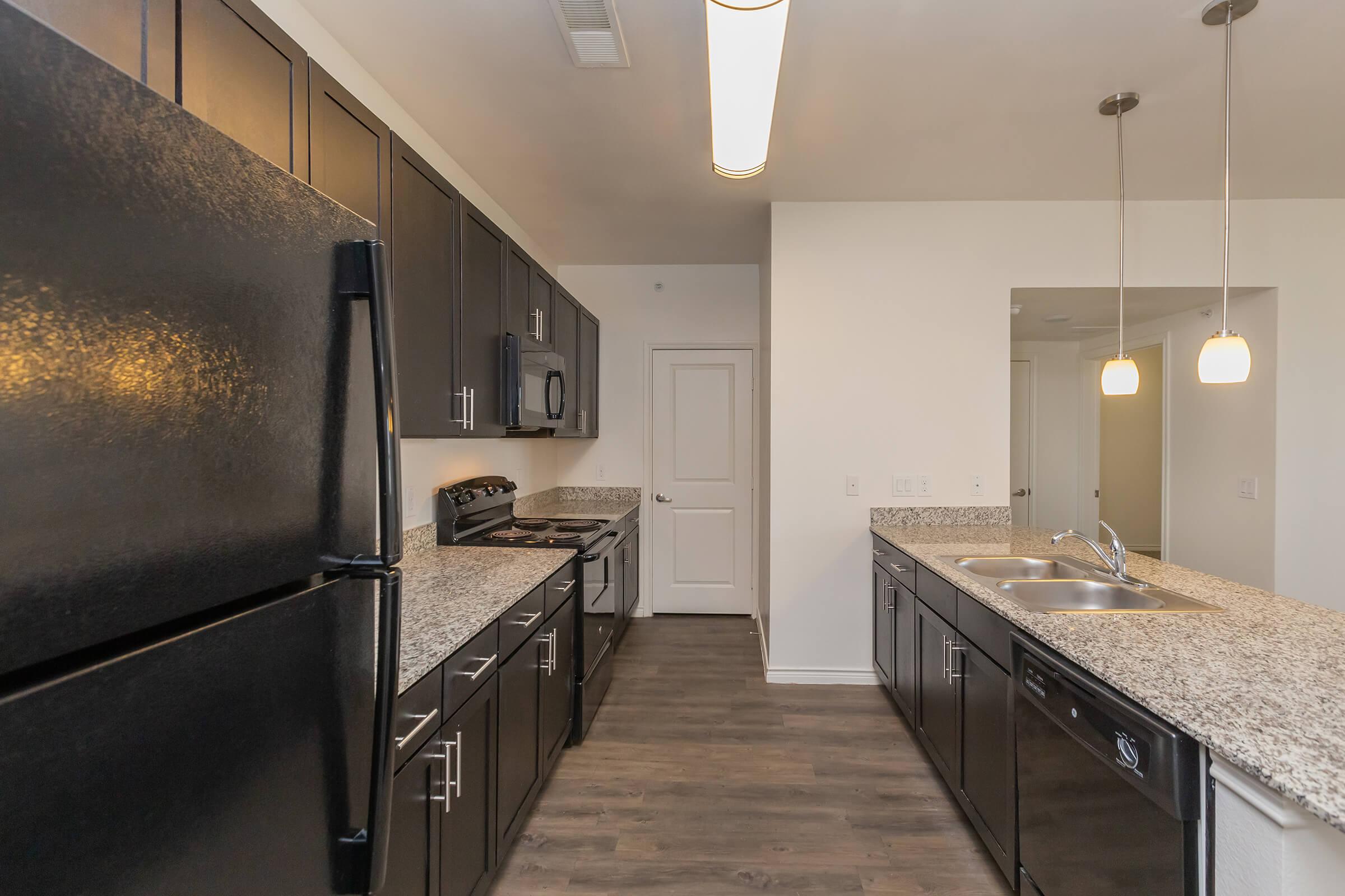 a large kitchen with stainless steel appliances