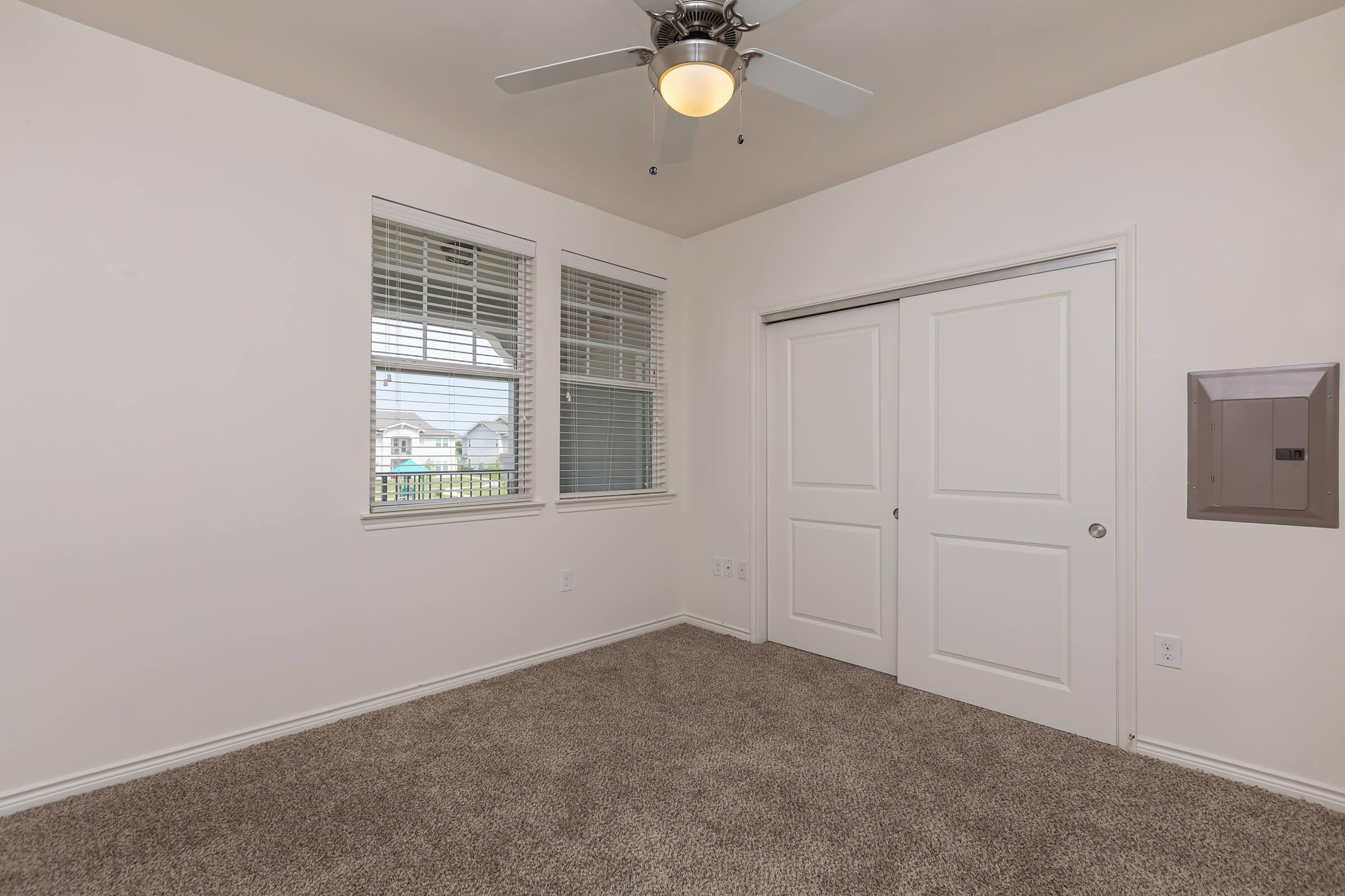 a bedroom with a large window