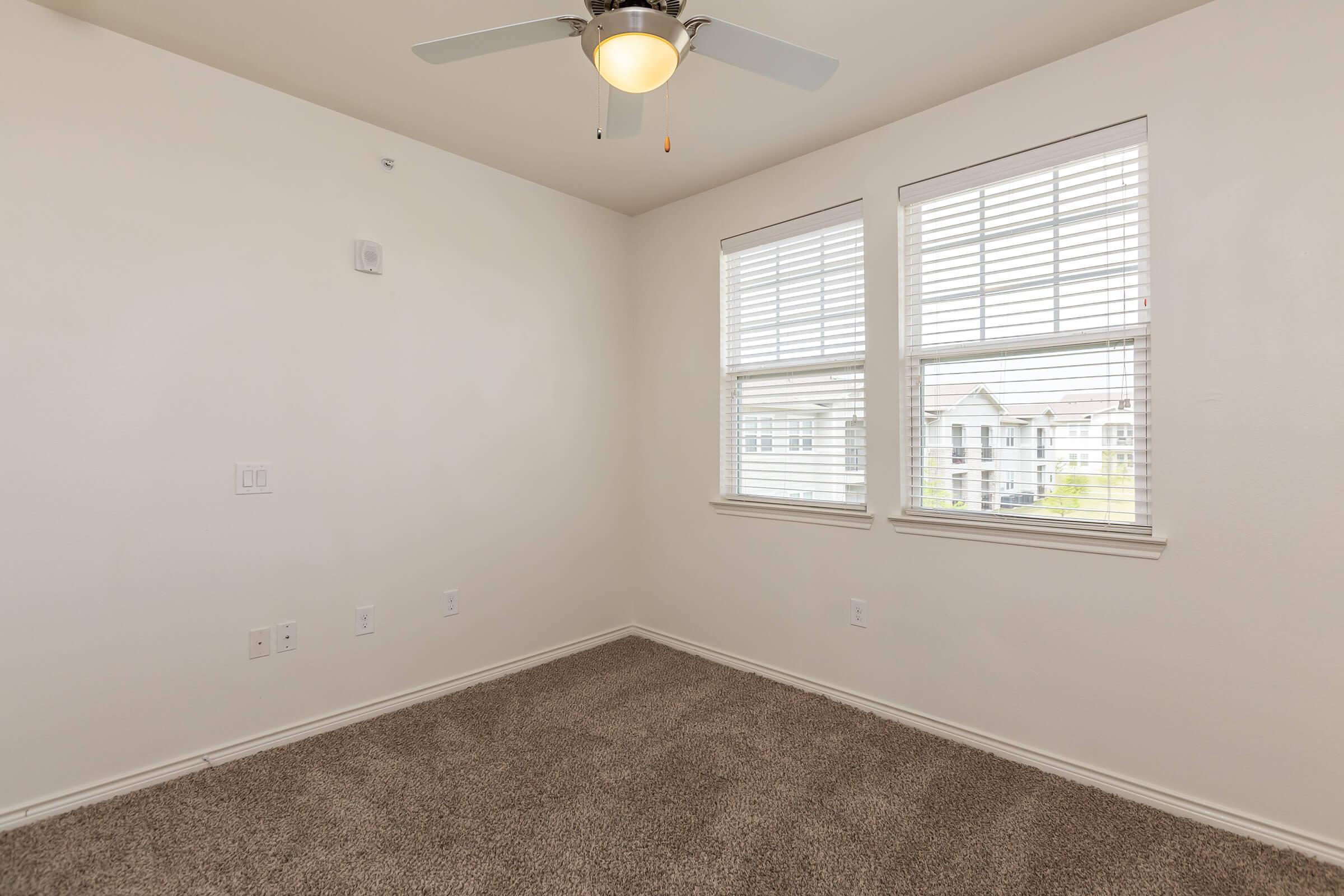 a bedroom with a large window