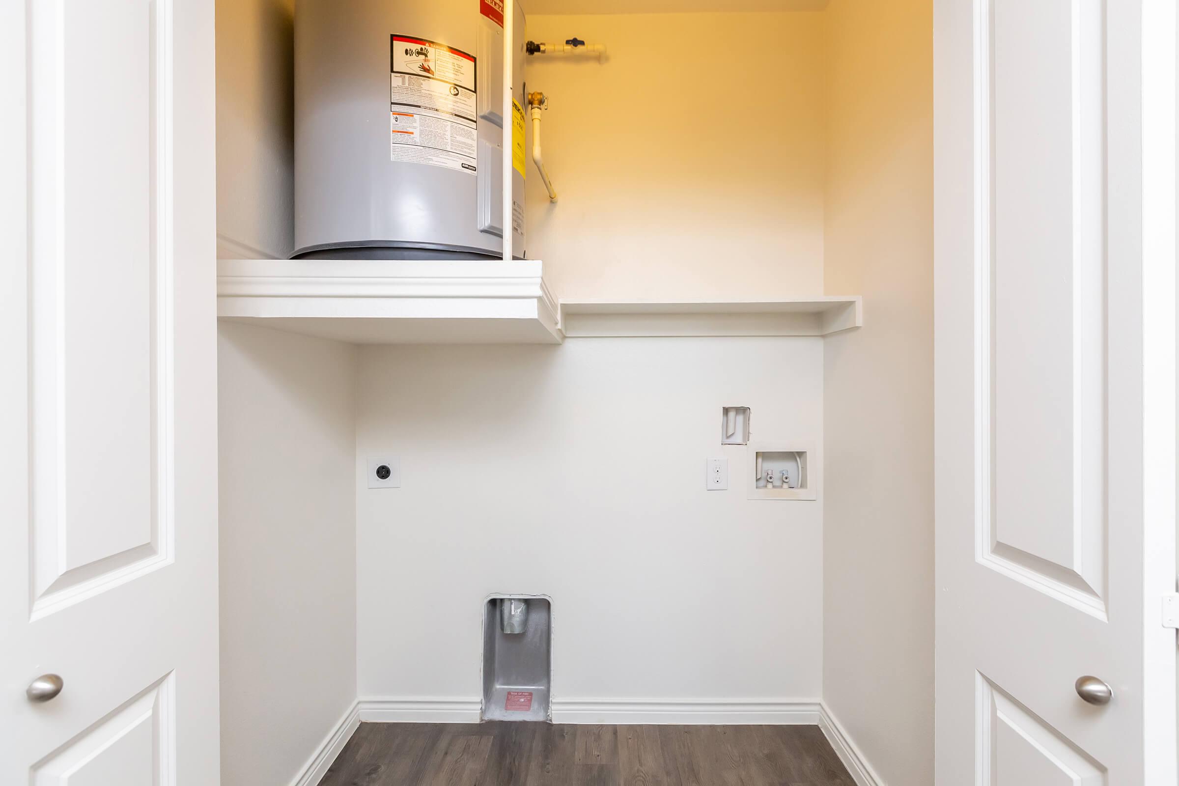 a white sink sitting under a window