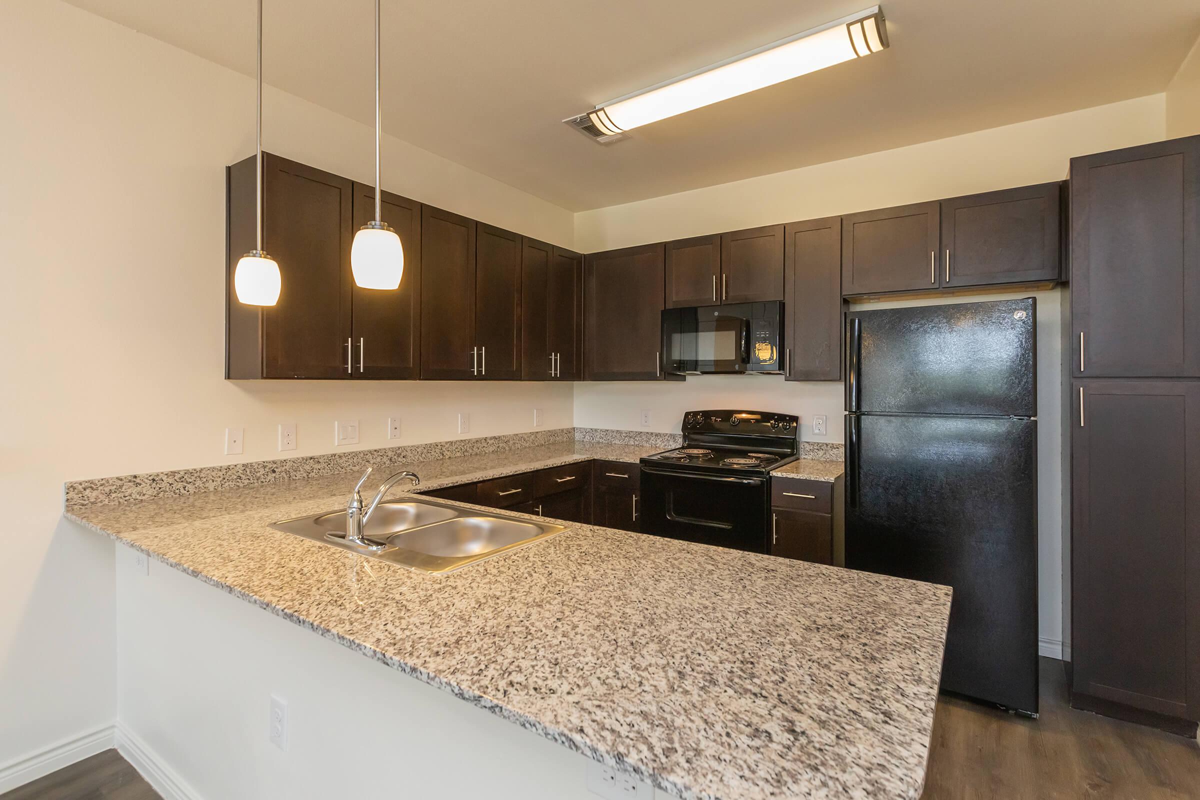 a modern kitchen with stainless steel appliances