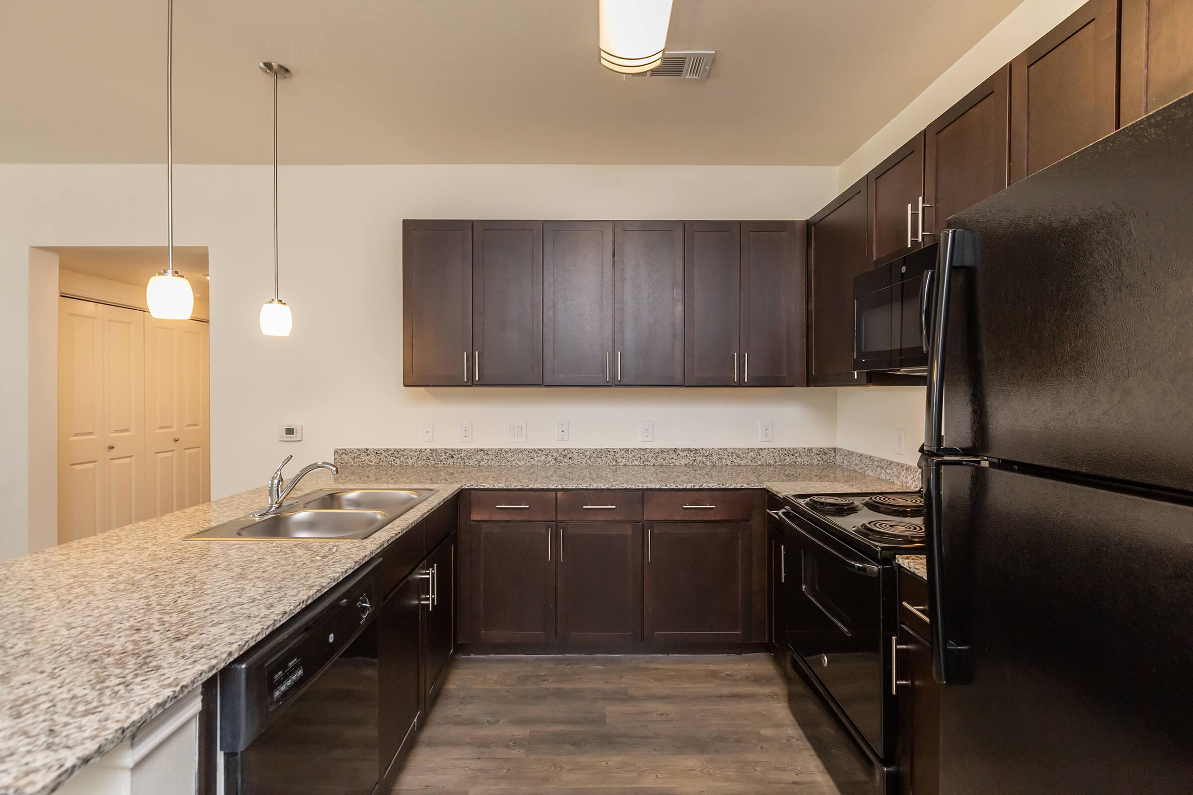 a modern kitchen with stainless steel appliances