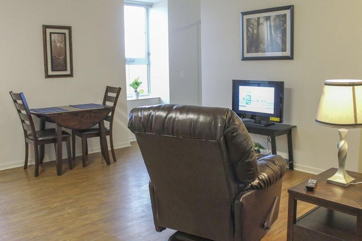 a living room with a leather chair