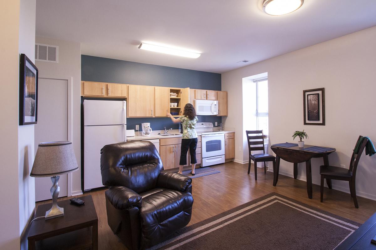 a living room filled with furniture and a flat screen tv