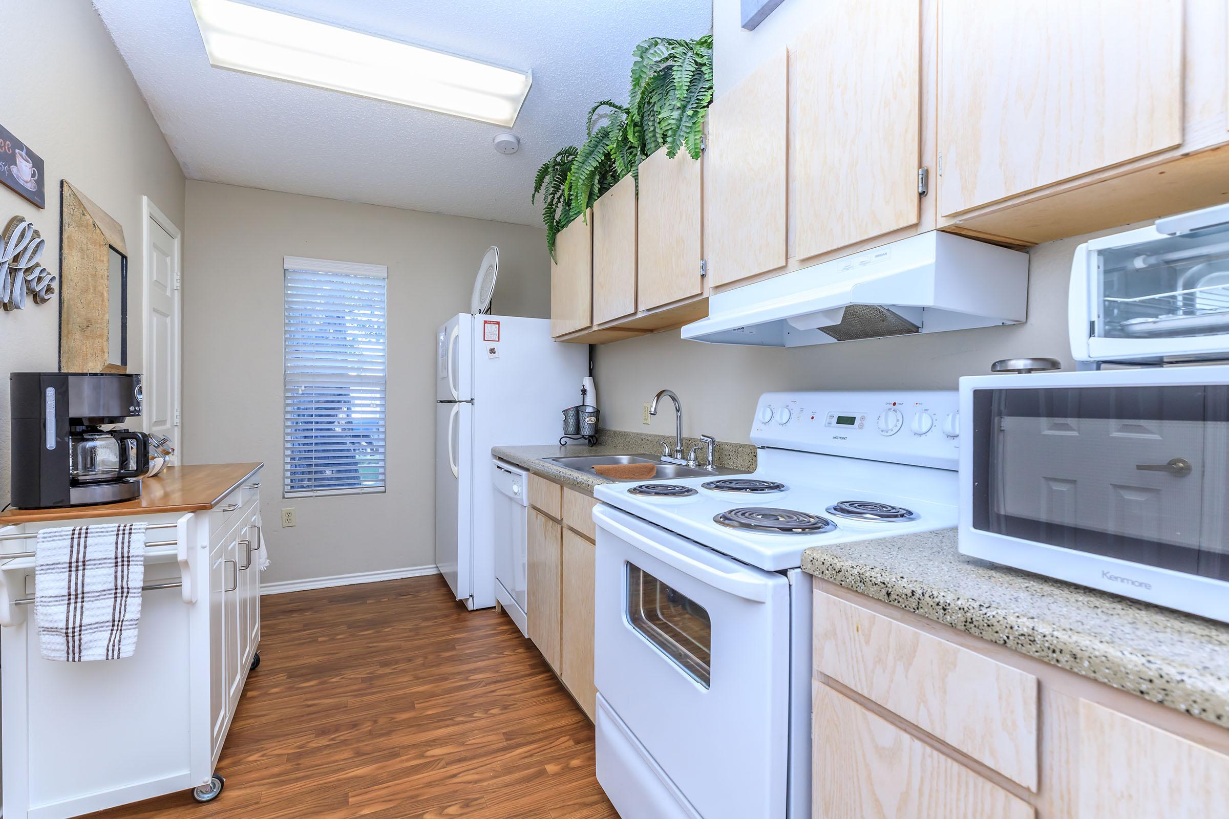 a kitchen with a sink and a window