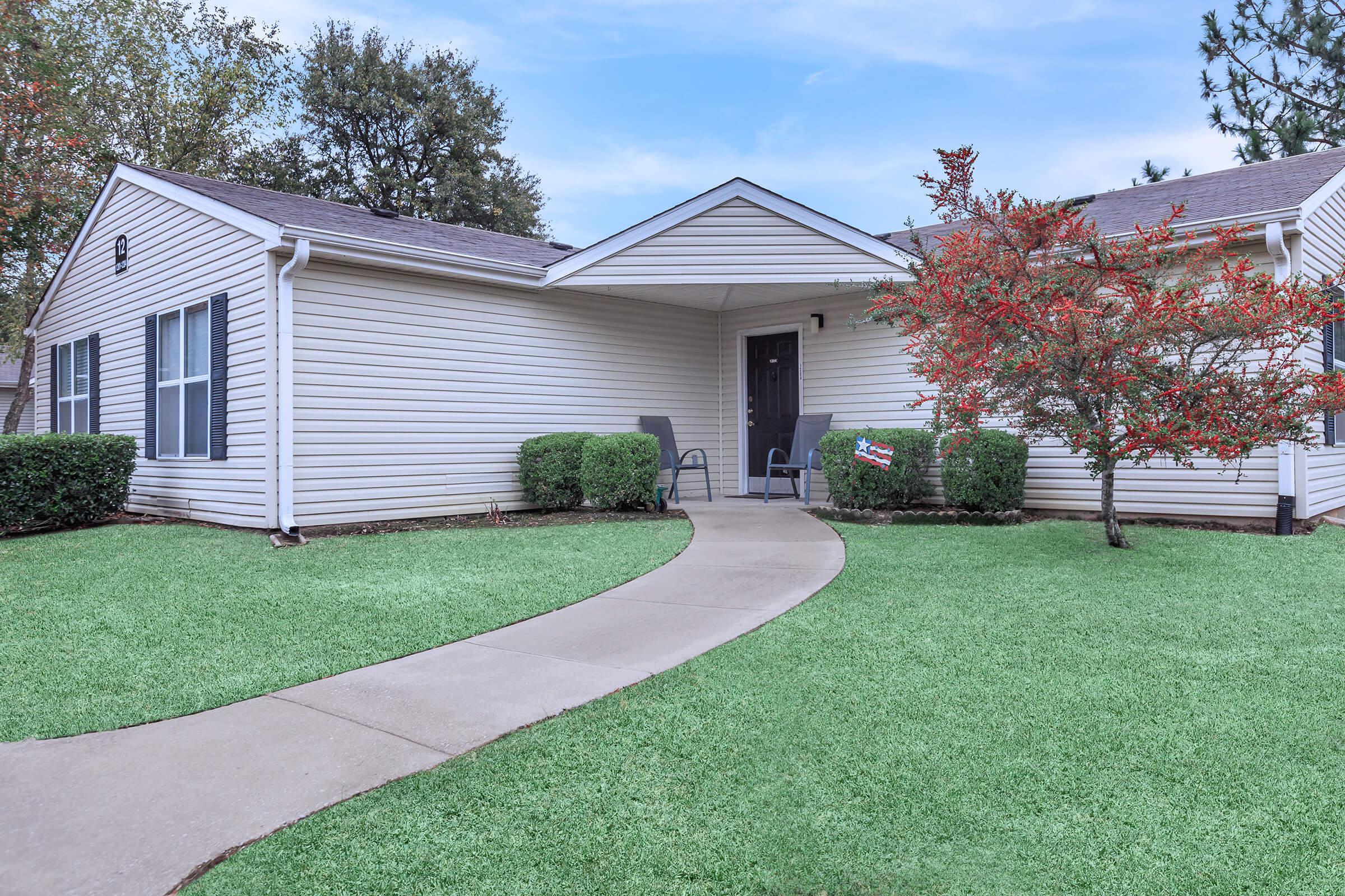 a large lawn in front of a house