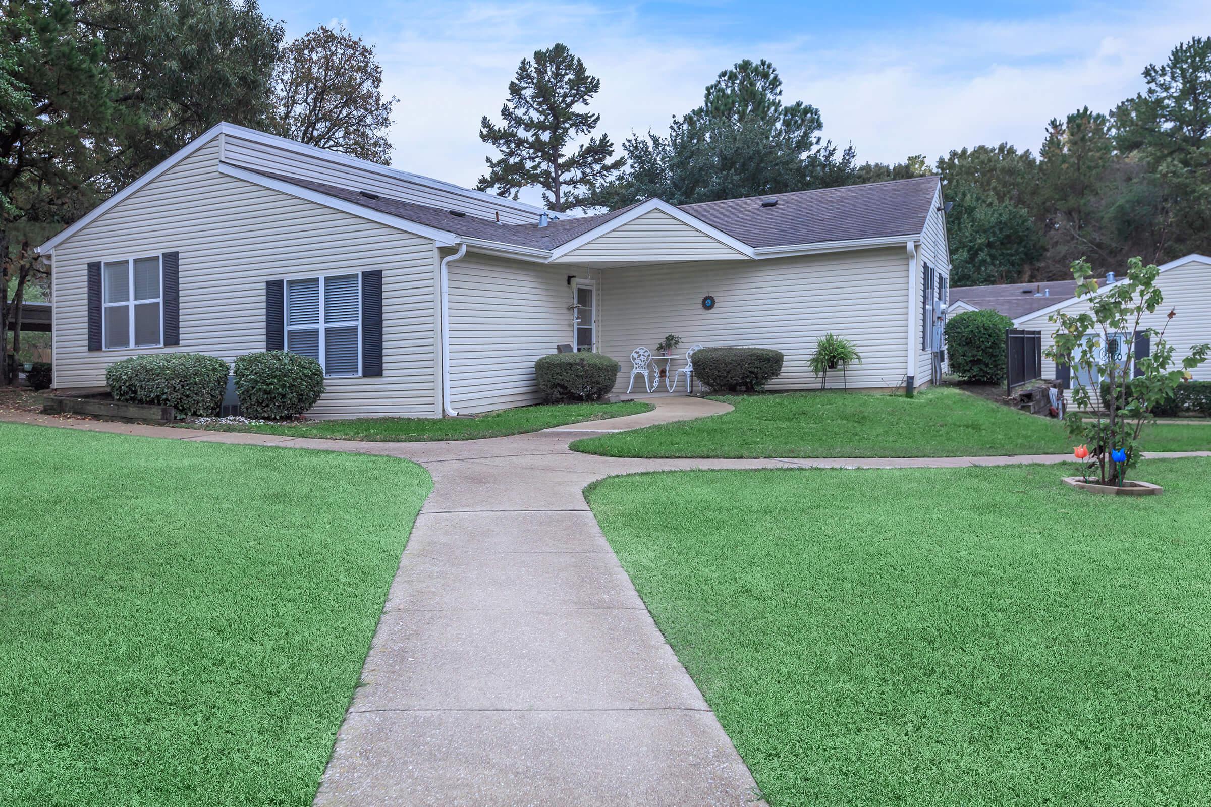 a large lawn in front of a house