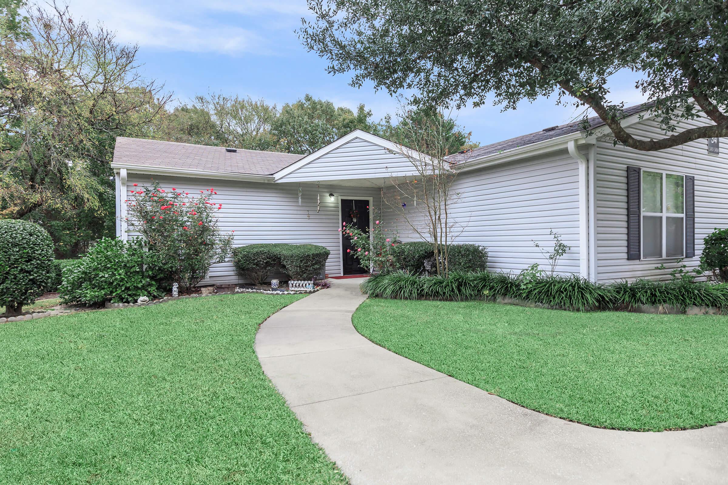 a large lawn in front of a house