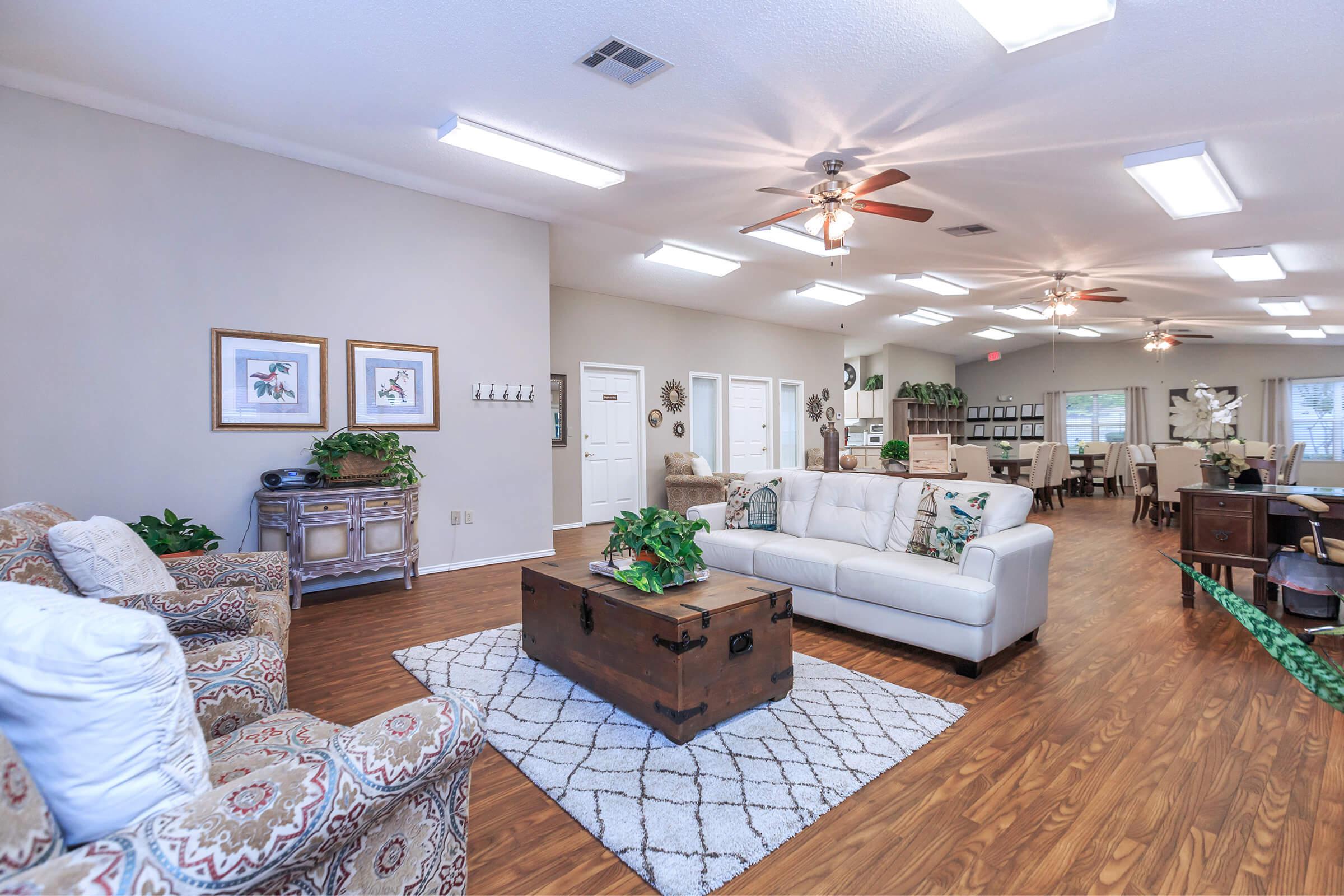 a living room filled with furniture and a flat screen tv