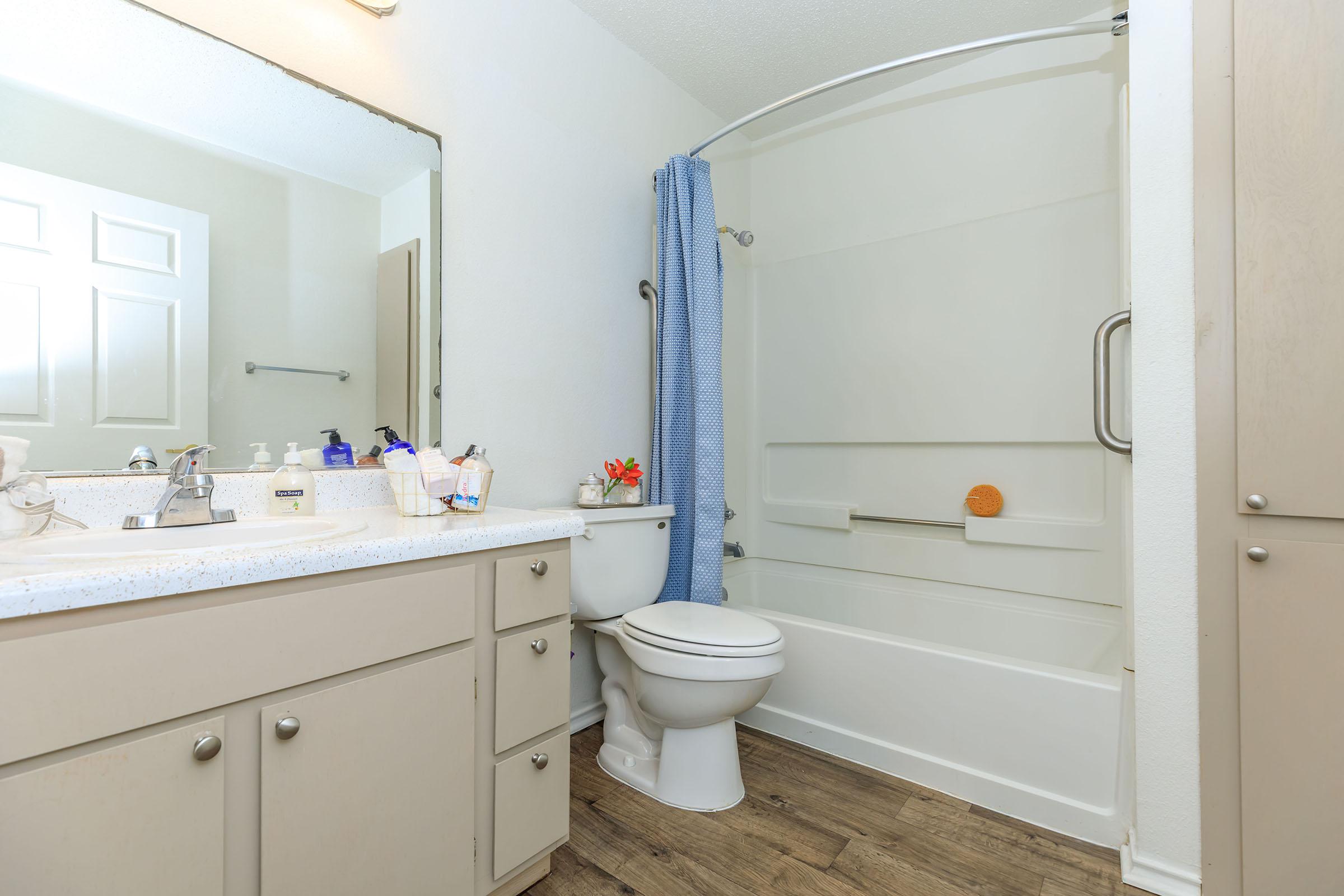 a kitchen with a sink and a mirror