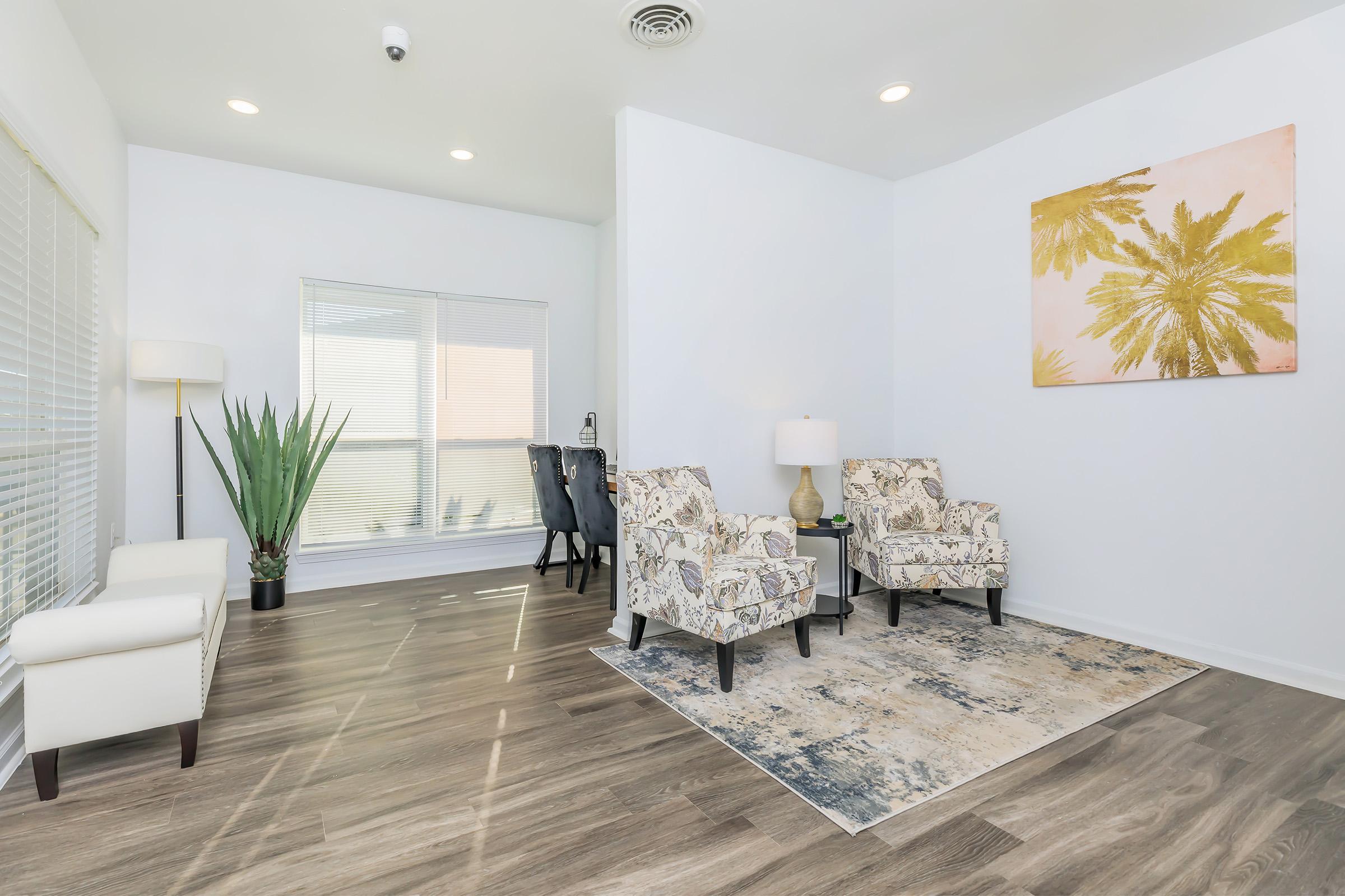 a room filled with furniture and a large window