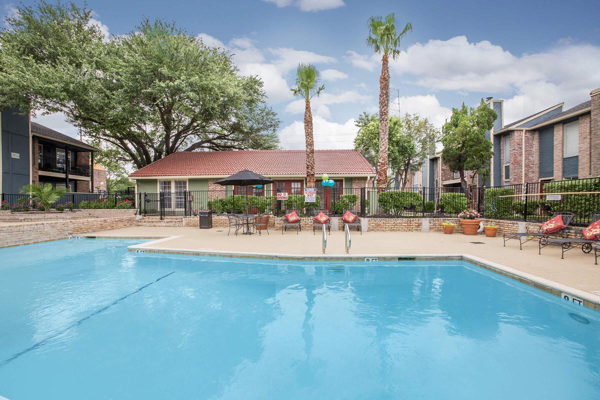 a large pool of water in front of a house