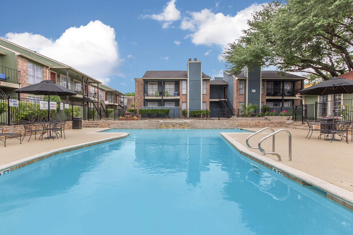 a large pool of water in front of a house