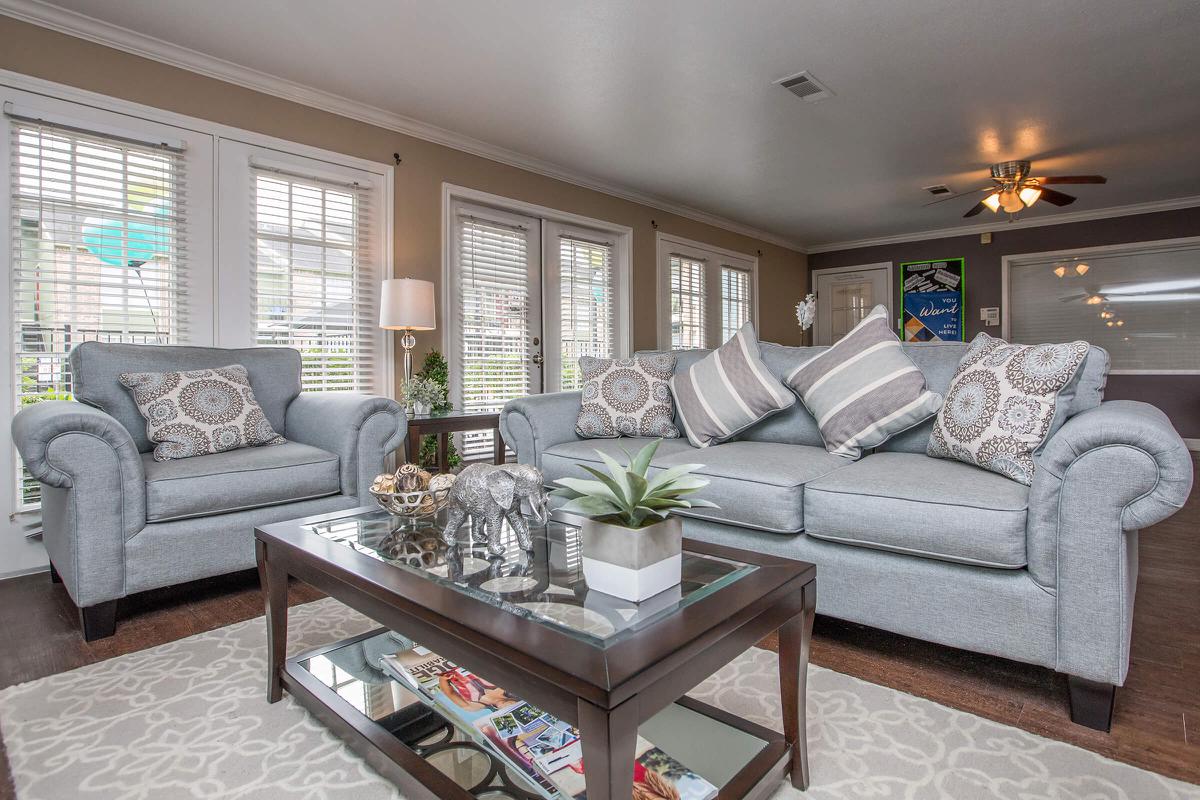 a living room filled with furniture and a fire place