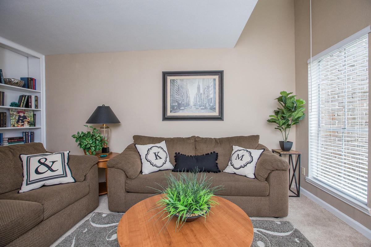 a living room filled with furniture and a fire place