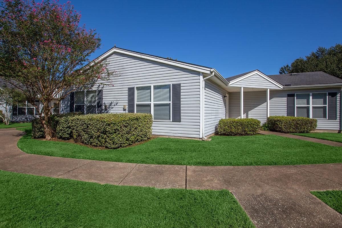 a large lawn in front of a house