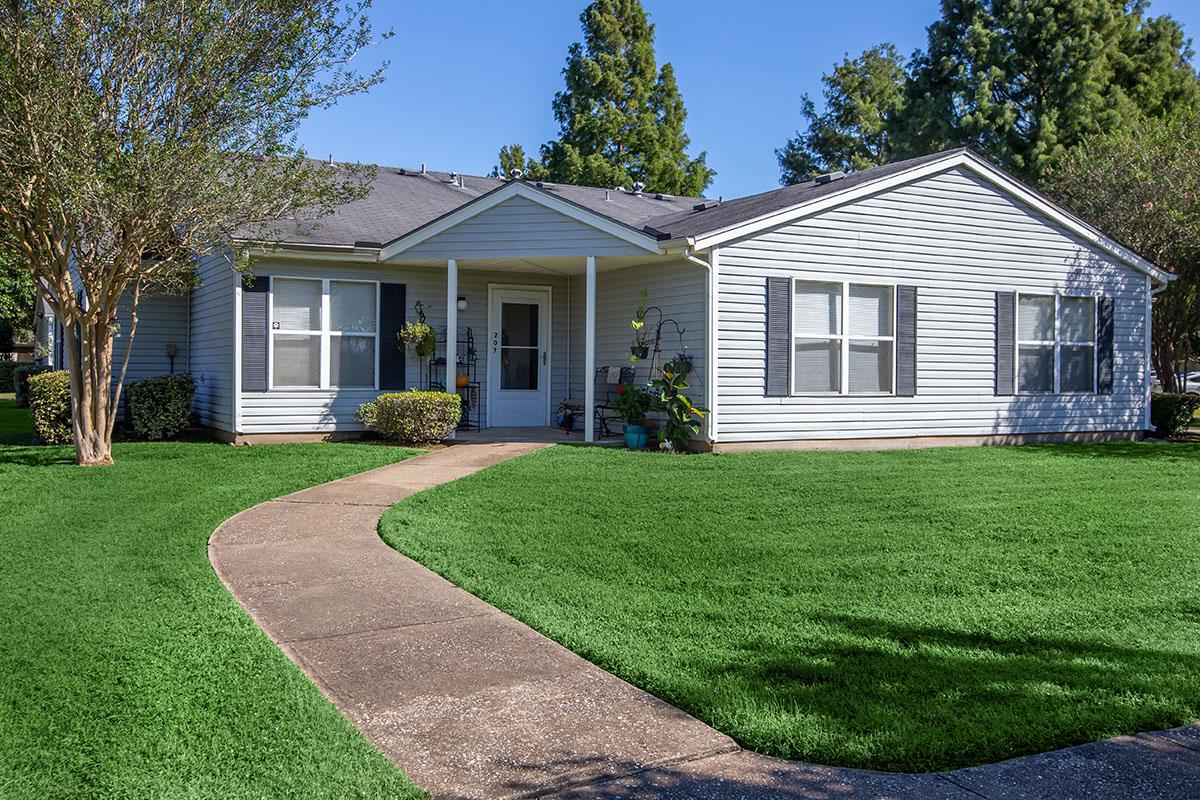 a large lawn in front of a house