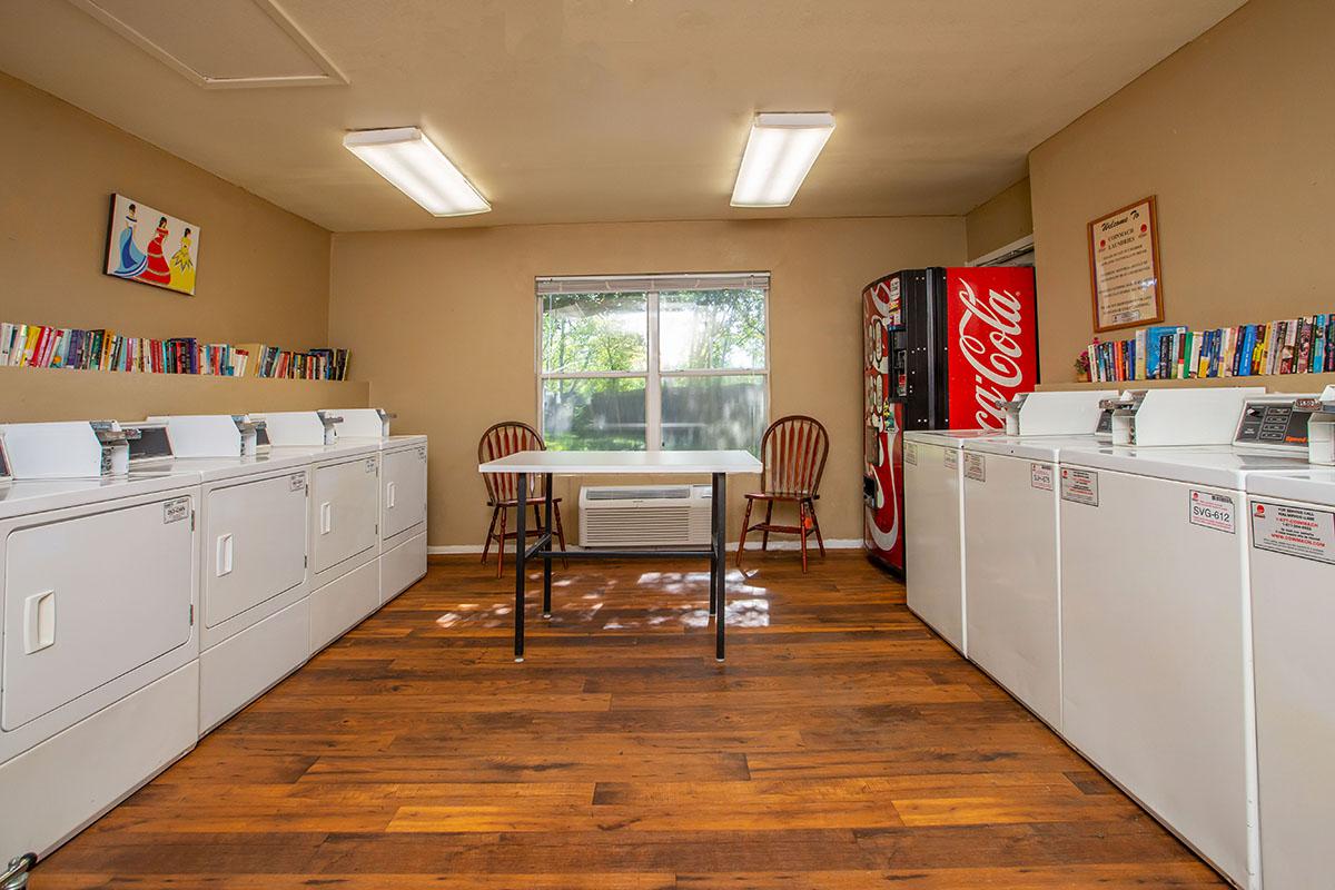 a room filled with furniture and a wood floor